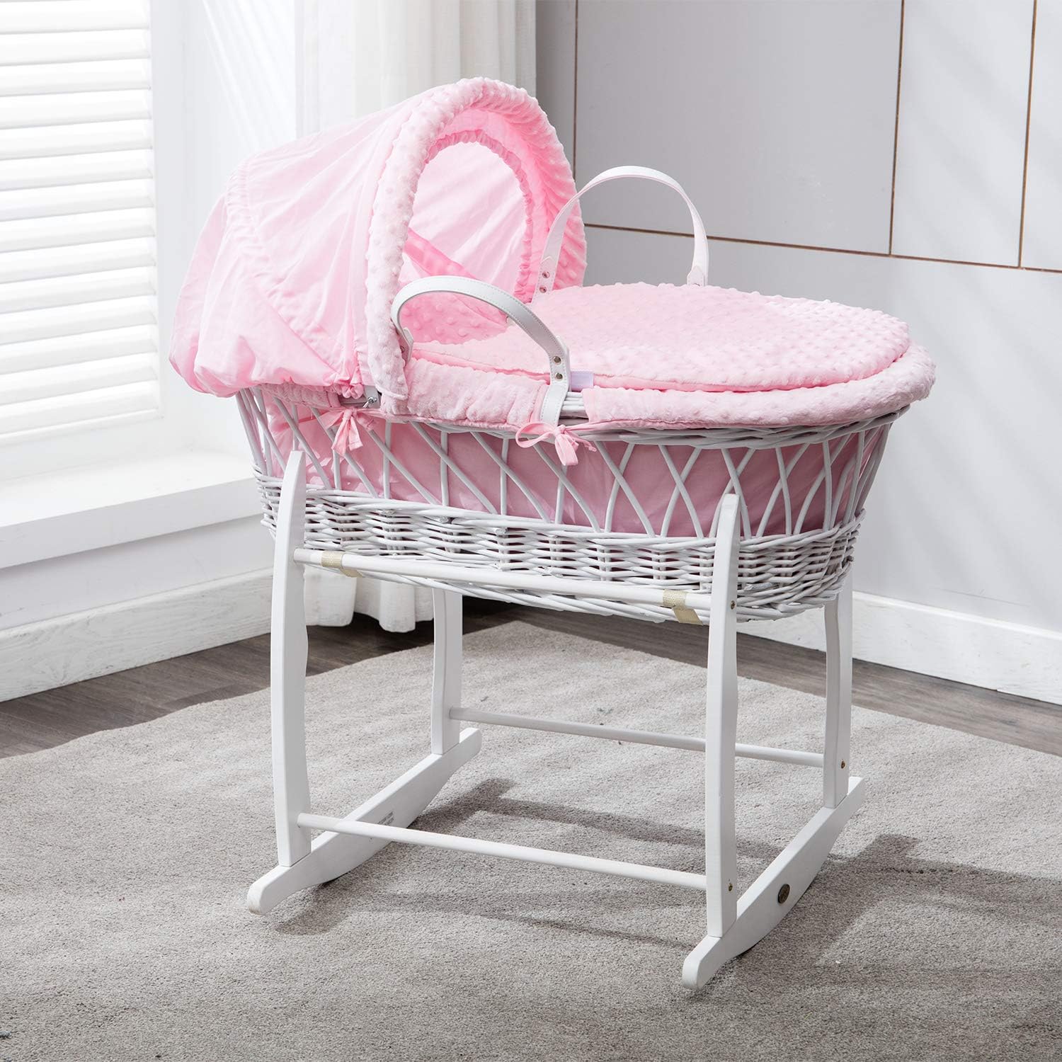pink moses basket with rocking stand