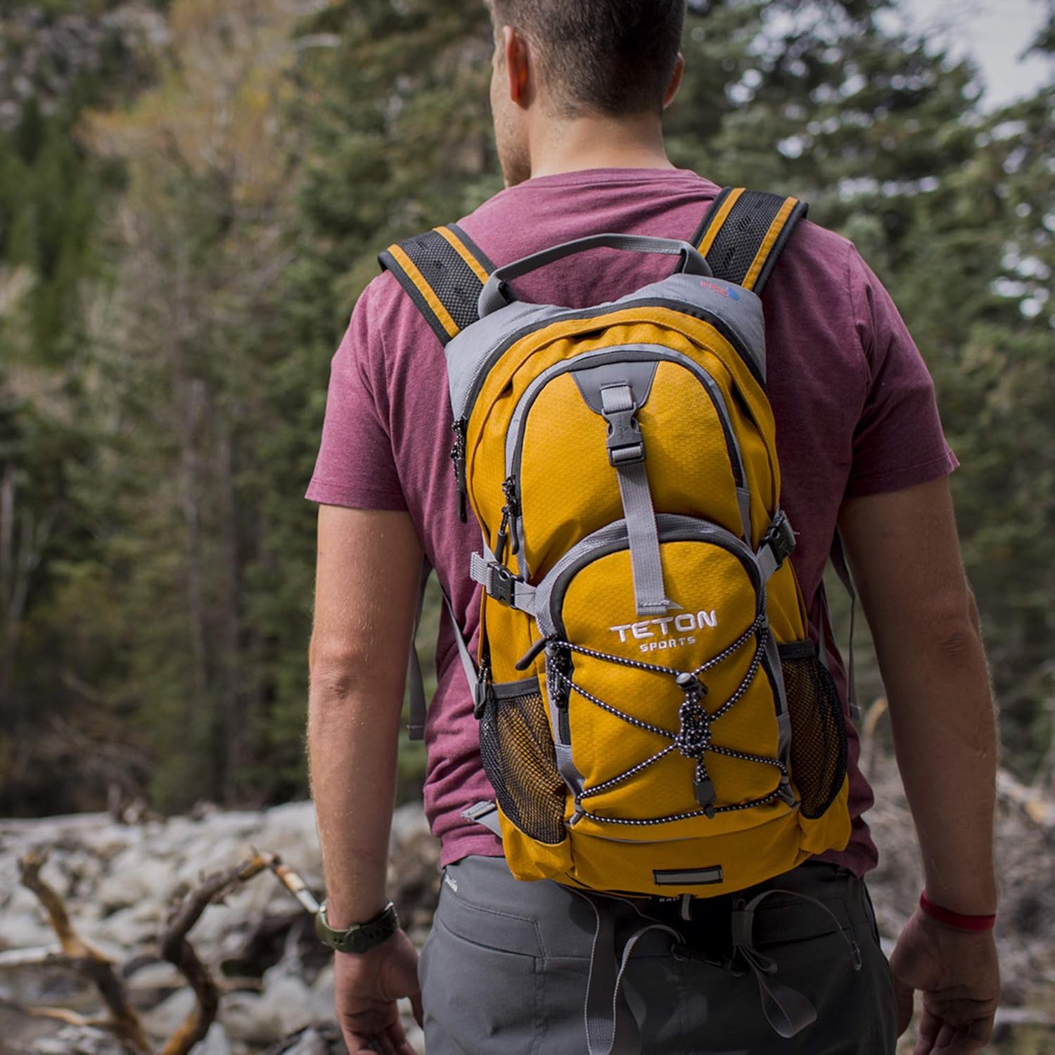 TETON Sports Oasis 1100 Hydration Pack; Free 2-Liter Hydration Bladder; For Backpacking, Hiking, Running, Cycling, and Climbing; Orange : Sports & Outdoors
