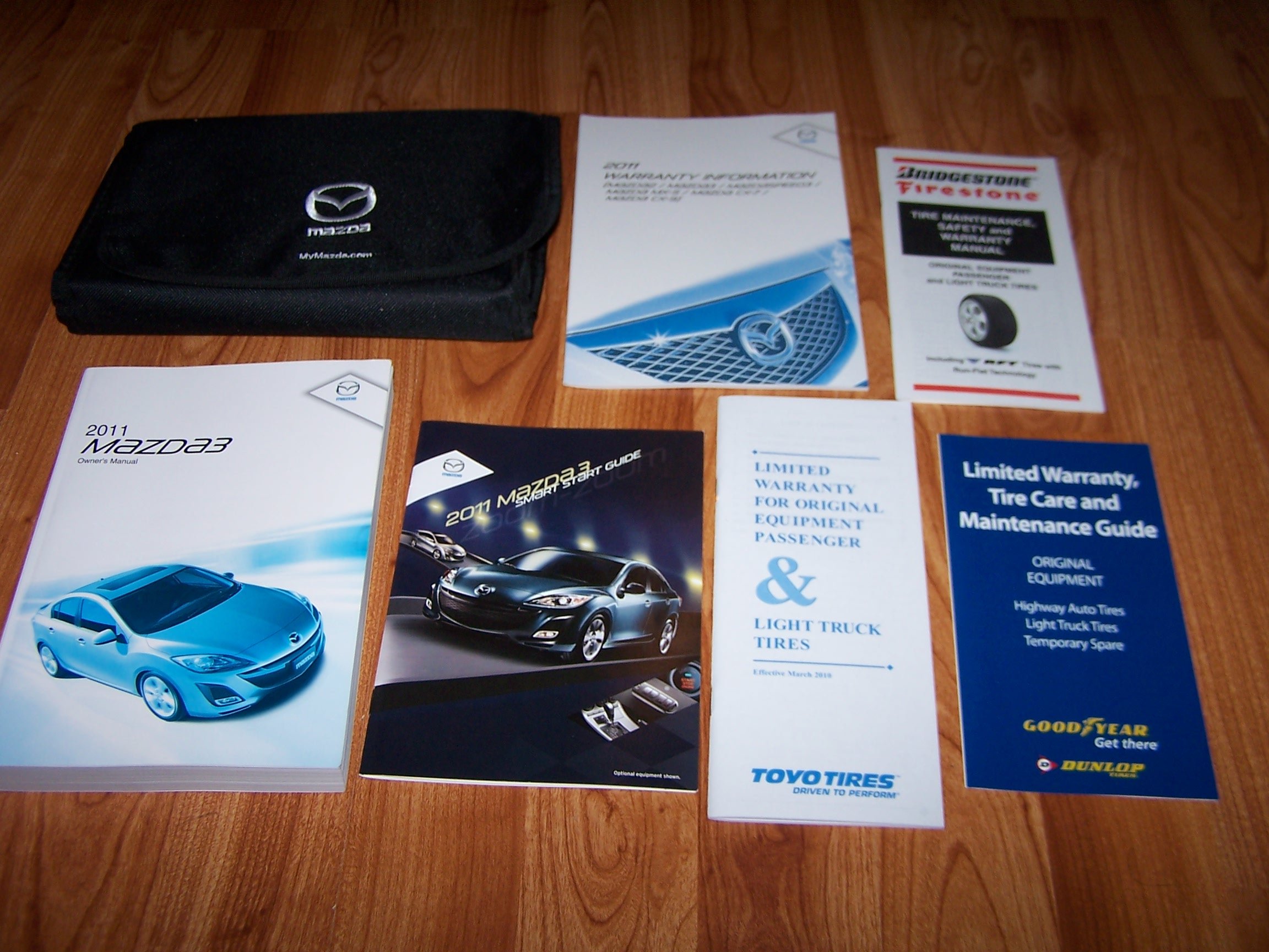 2011 Mazda 3 Owners Manual with Case Guide Books Paperback – 1911