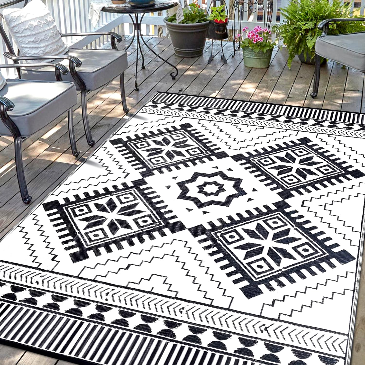 Photo 1 of Waterproof Outdoor Rug 8x10ft, Boho Reversible Plastic Straw Mat for Patio RV Deck Porch Backyard Balcony Camping Picnic Beach Indoor Outdoor Carpet, Black&White