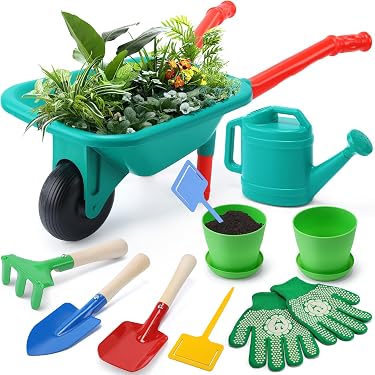 Brouette Avec Des Fleurs Et Des Outils De Jardinage D'isolement Image