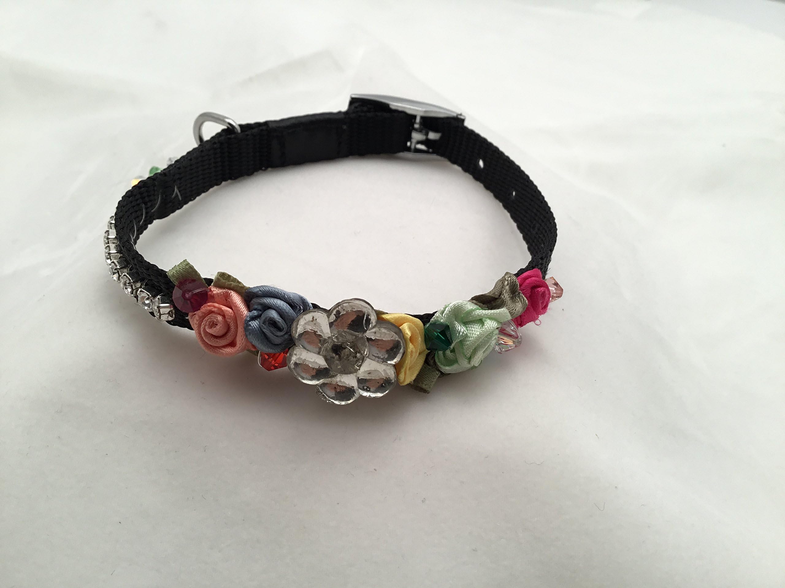 Black Nylon Dog Collar Adorned With Peach, Green, Blue, and Rose Silk Rosettes as well as Crystals and a Swarovski Crystal Chain.
