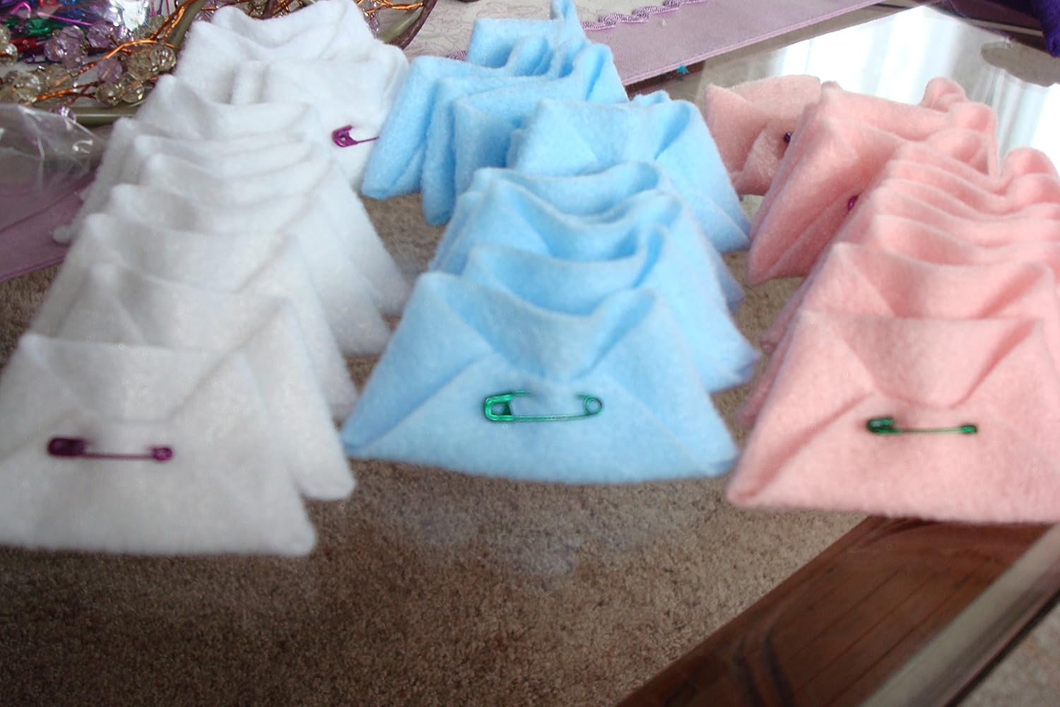 pin the diaper on the baby