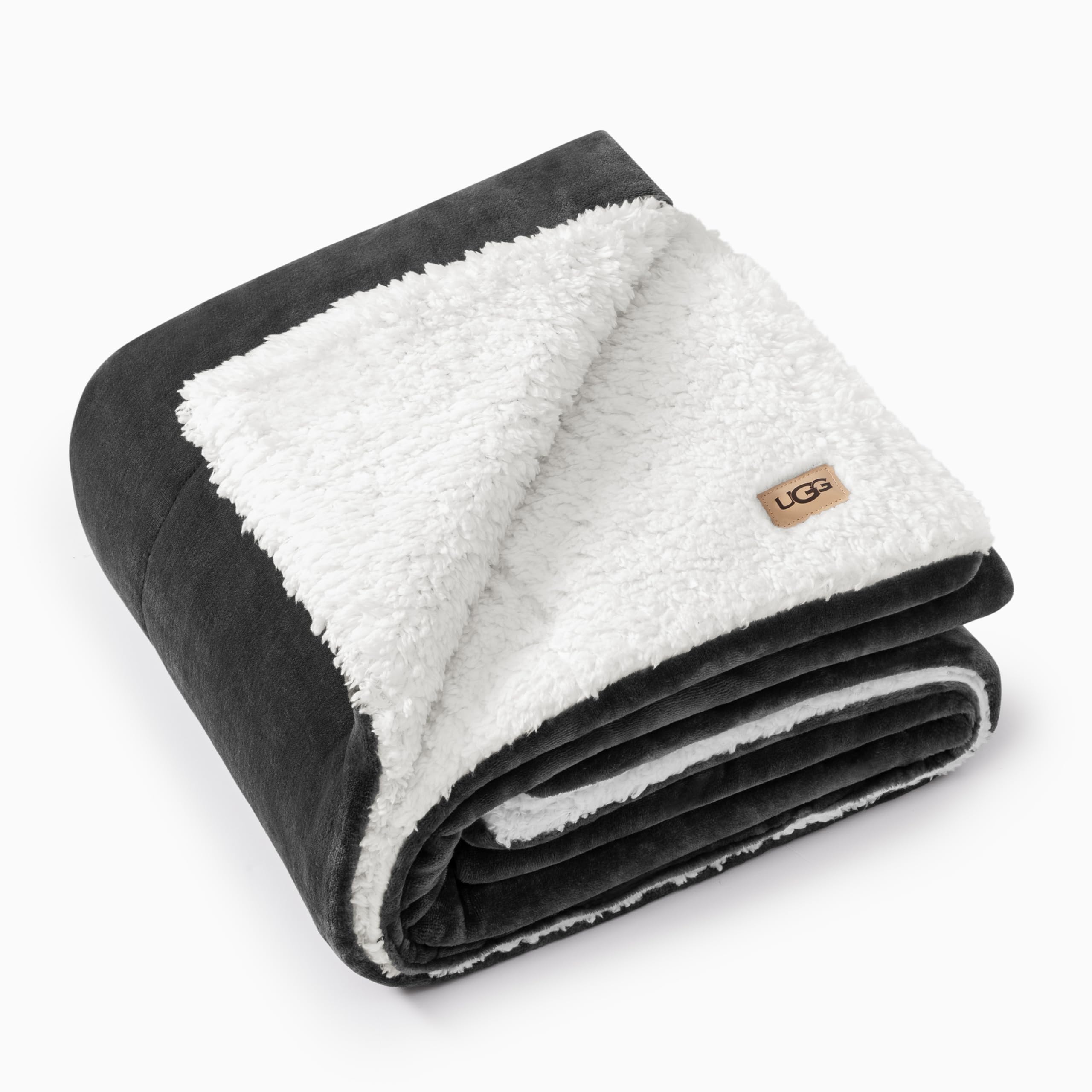 Photo 1 of UGG Nita Throw Blanket Soft Reversible Plush Throw for Couch or Bed Washable Warm Fluffy Blanket for College Dorm Essentials and Bedding with Down Alternative Fill, 50-inch x 70-inch, Charcoal Grey