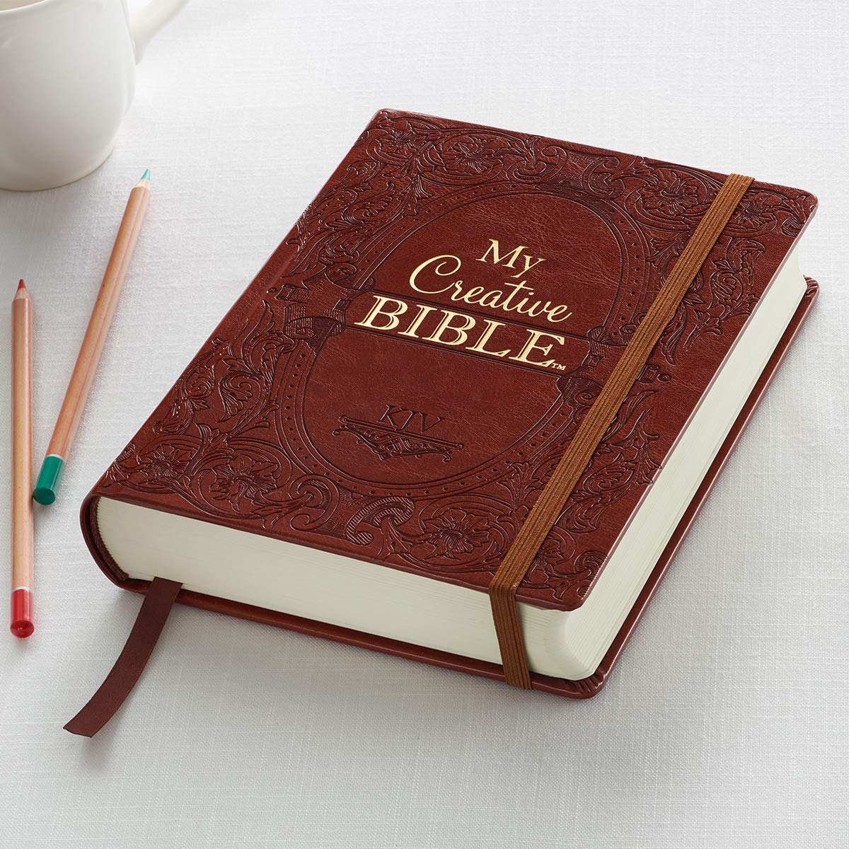 KJV Holy Bible, My Creative Bible, Faux Leather Hardcover - Ribbon Marker, King James Version, Saddle Tan w/Elastic Closure (KJV Creative Editions) KJV Holy Bible, My Creative Bible, Faux Leather Hardcover - Ribbon Marker, King James Version, Saddle Tan w/Elastic Closure (KJV Creative Editions) Hardcover