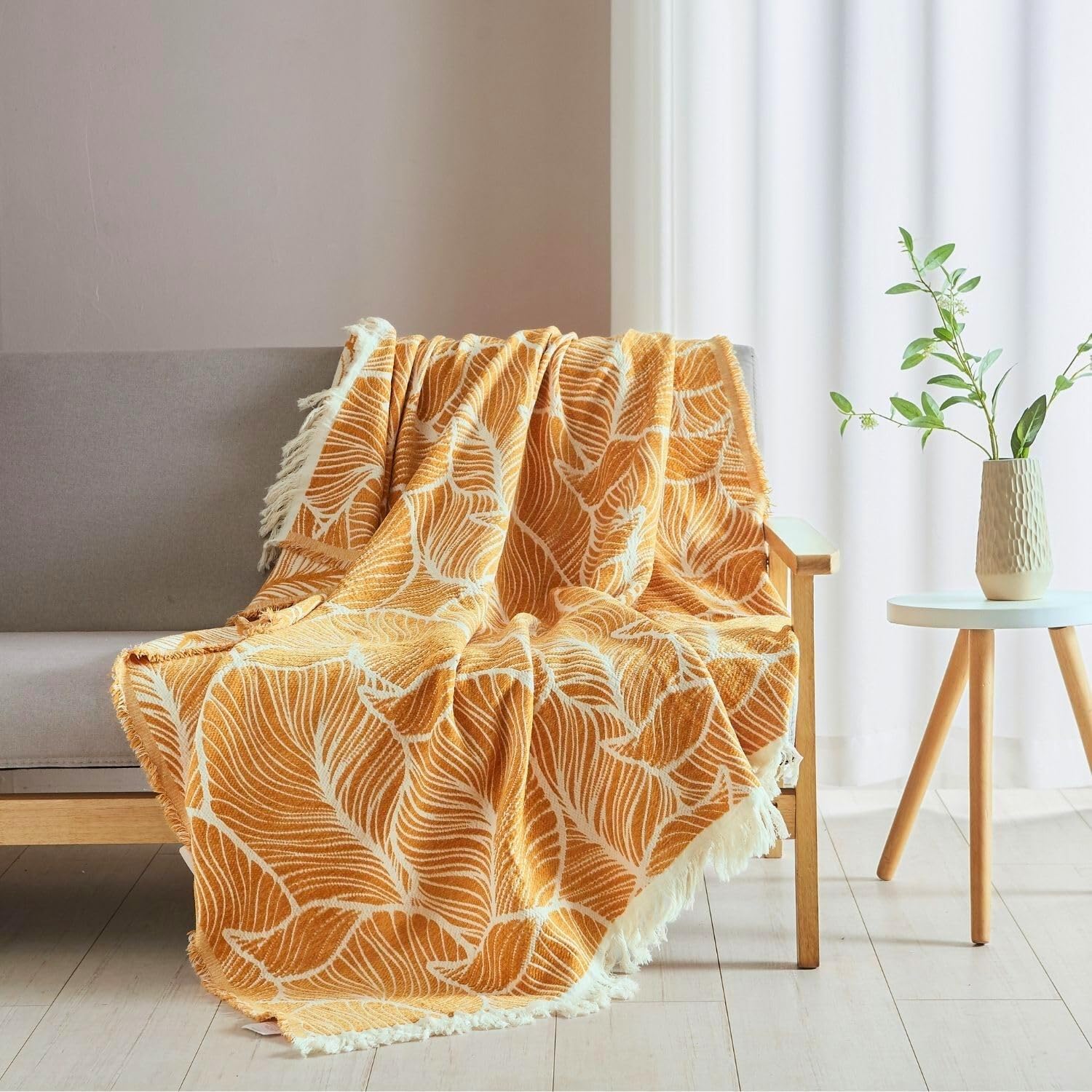 Photo 1 of DOWN HOME Boho Throw Blanket for Couch, Chenille Cotton Lightweight Summer Throw Blanket for Bed Sofa Chair Living Room Outdoor Soft Woven Decorative Blanket with Tassel Gift Orange Leaves 55"x60"
