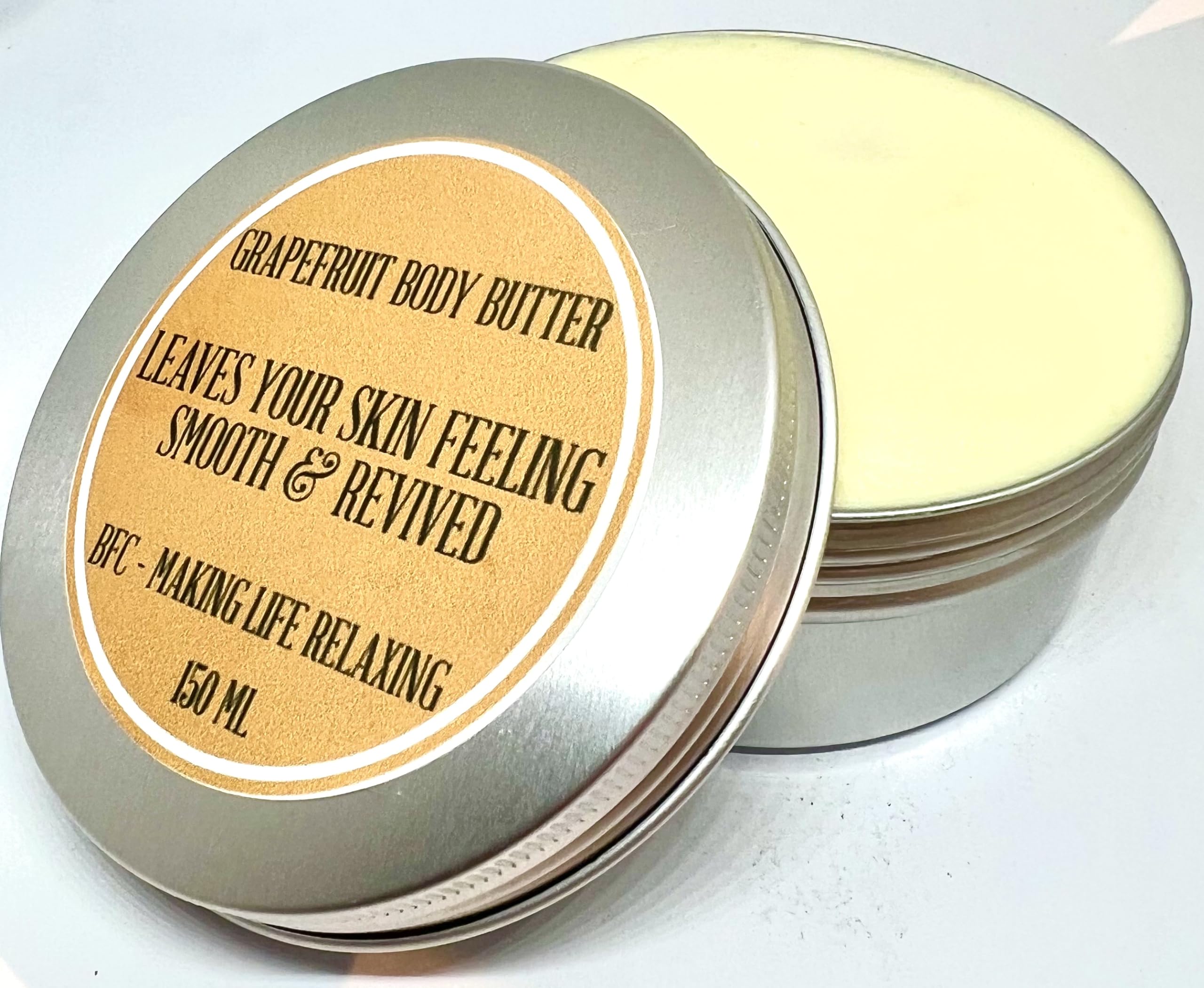 BFC Body Butter Grapefruit Scented 150ML Silver Tin - Made with Mango Butter, Shea Butter, Sweet Almond Carrier Oil and pure Grapefruit Essential Oil. Shipping on 48 Hour Tracked Service