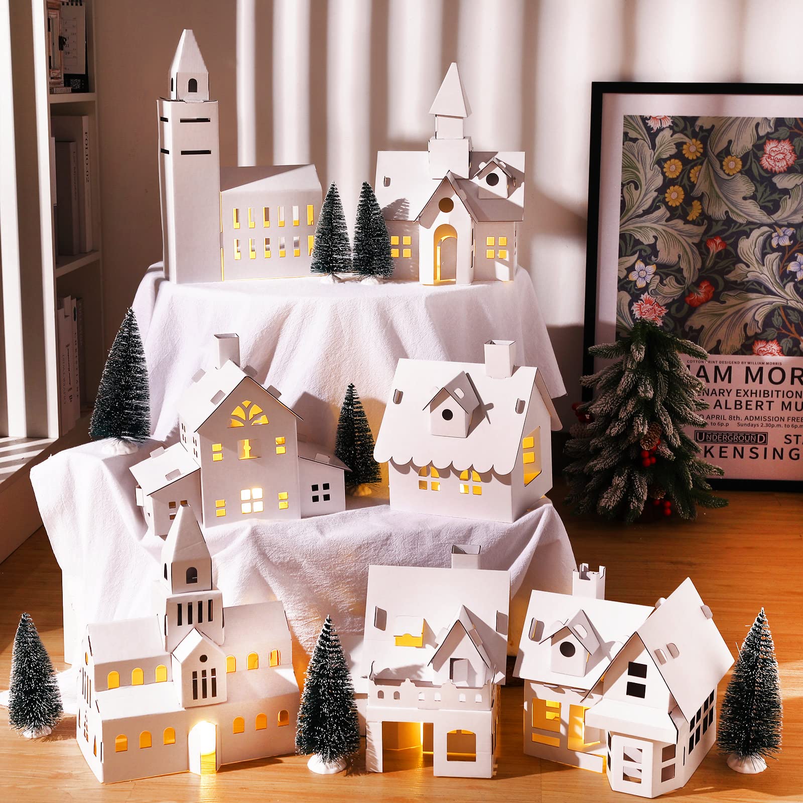 Photo 1 of Nezyo 14 Pcs DIY Christmas Village Sets 7 White 13 Inch Unassembled Cardboard Christmas House with 7 Xmas Tree for Kids Adult Arts Crafts Collection Indoor Room Table Decor Architecture Gift