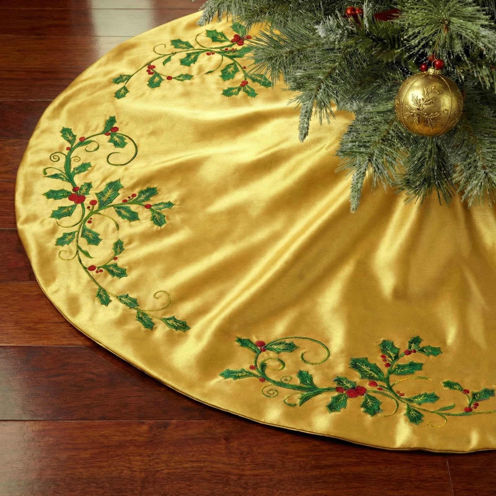 Photo 1 of 48 Inch Deluxe Satin Christmas Tree Skirt Gold Embroidered Holly Leaf Luxury Silk Skirts with Foam Padding Ribbon Bow Bright Silk Smooth Tree Skirt for Home Xmas Holiday Decorations(Gold)