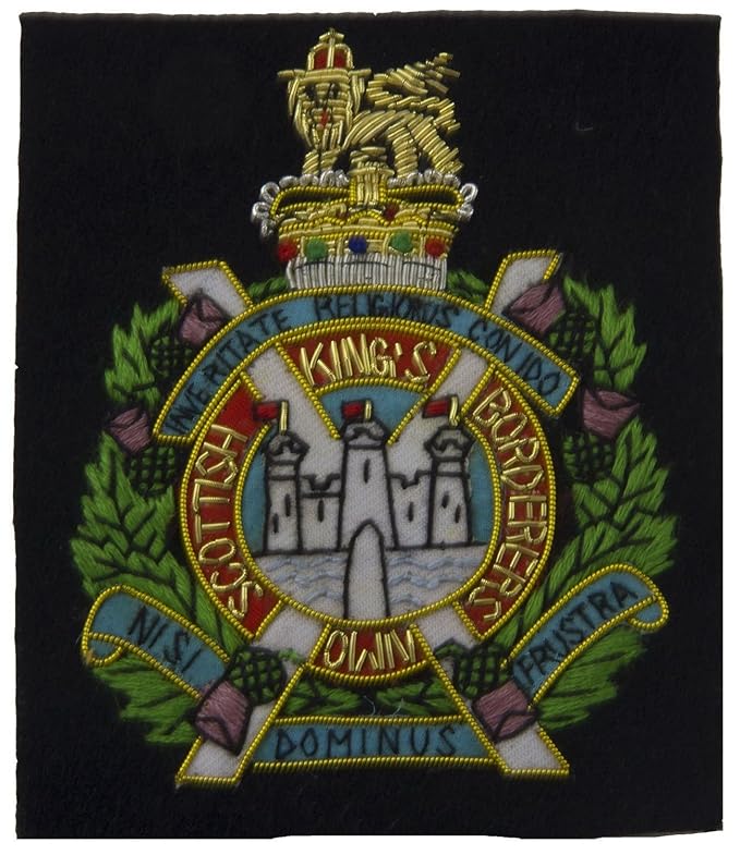 A Victorian King's Own Scottish Borderers Cap Badge Together With A