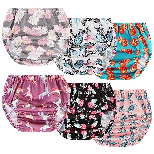 toddler girl wearing panties over diaper 