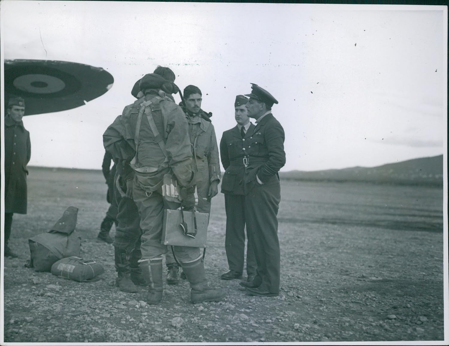 Photographs - Vintage photo of Just landed after a raid over Valona, This R.A.F. Bomber crew are seen telling their squadron leader about the raid.