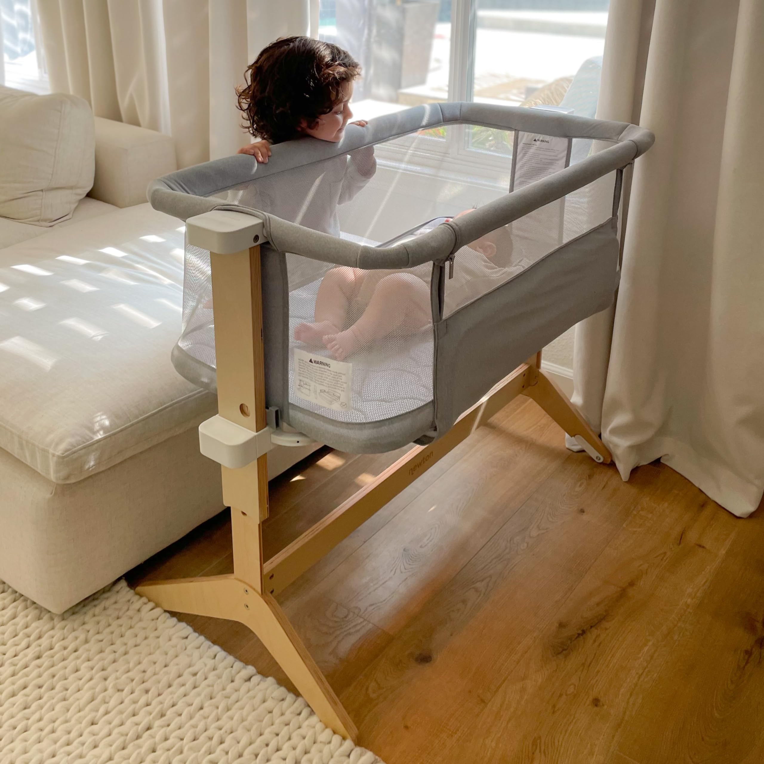 Newton Baby Bassinet & Bedside Sleeper with Mattress & Sheet - Ultra-Breathable & Completely Washable, Removable Dual-Layer Cover | Solid Birch Frame Adjustable Height & Infant Access Opening