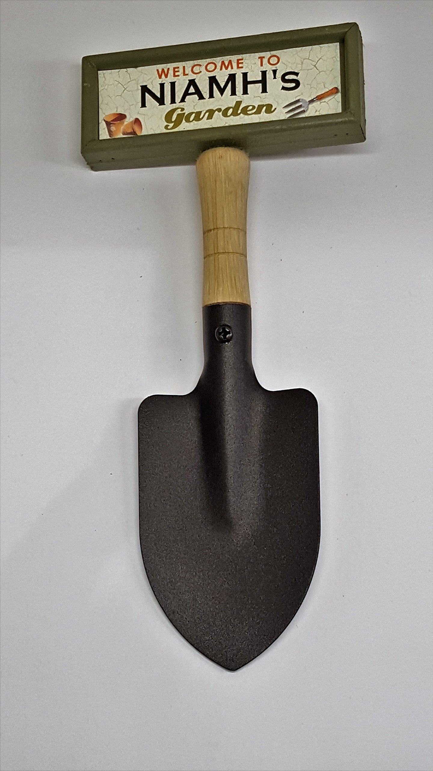 "Welcome to Niamh's garden" hanging shovel sign