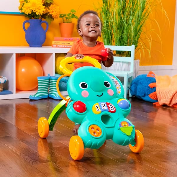 BRIGHT STARTS STROLL ‘N ROLL 2-IN-1-BALL PUSH WALKER – INCLUDES 3 TOY BALLS, ELEPHANT WITH 70+ SONGS & SOUNDS, 7 ACTIVITIES – BALL DROP, PIANO, SPINNER, FLIP BOOK & MORE