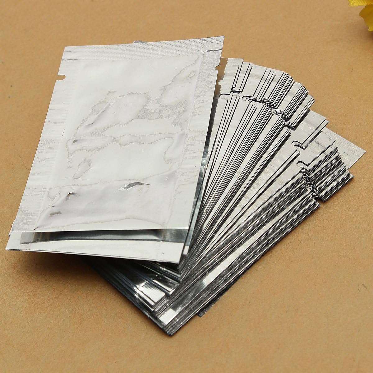 Lexpon 100 x Aluminium Foil Mylar Food Bags Vacuum Seal Silver Kitchen Food Bags, Silver Colours, 7 x 10 cm - Image 3