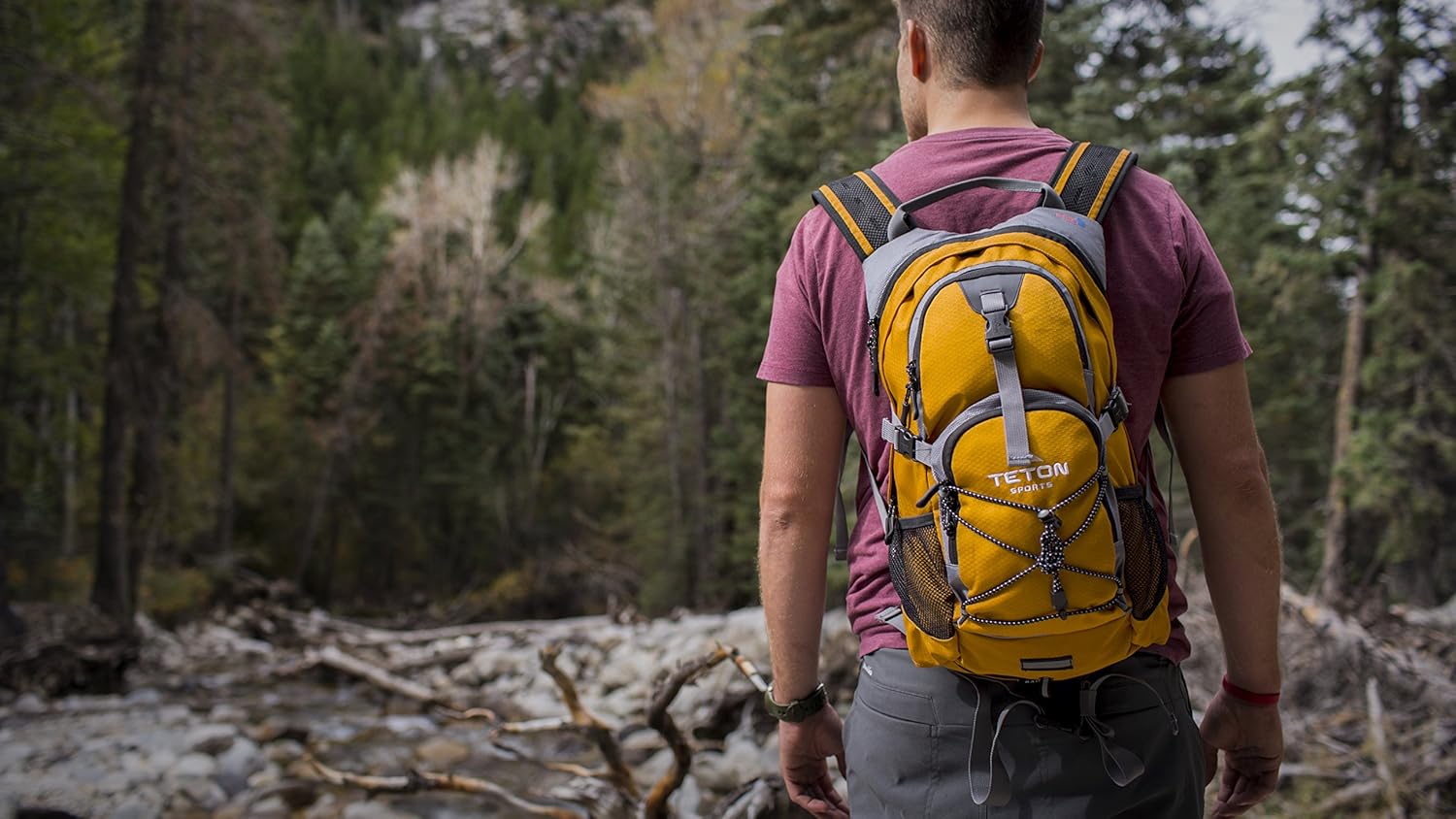 TETON Sports Oasis 1100 Hydration Pack; Free 2-Liter Hydration Bladder; For Backpacking, Hiking, Running, Cycling, and Climbing; Orange : Sports & Outdoors