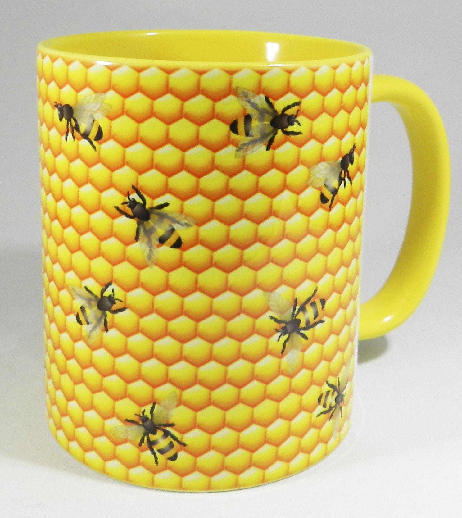 Half a Donkey Bees at the Honeycomb Mug with yellow glazed handle and inner