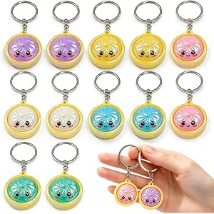 QUWEXO 12Pcs Metallic Keychain Set | Mini Glitter Cartoon Funny Face Bun Keychains, Backpack Pendant Charms, Random Color Par