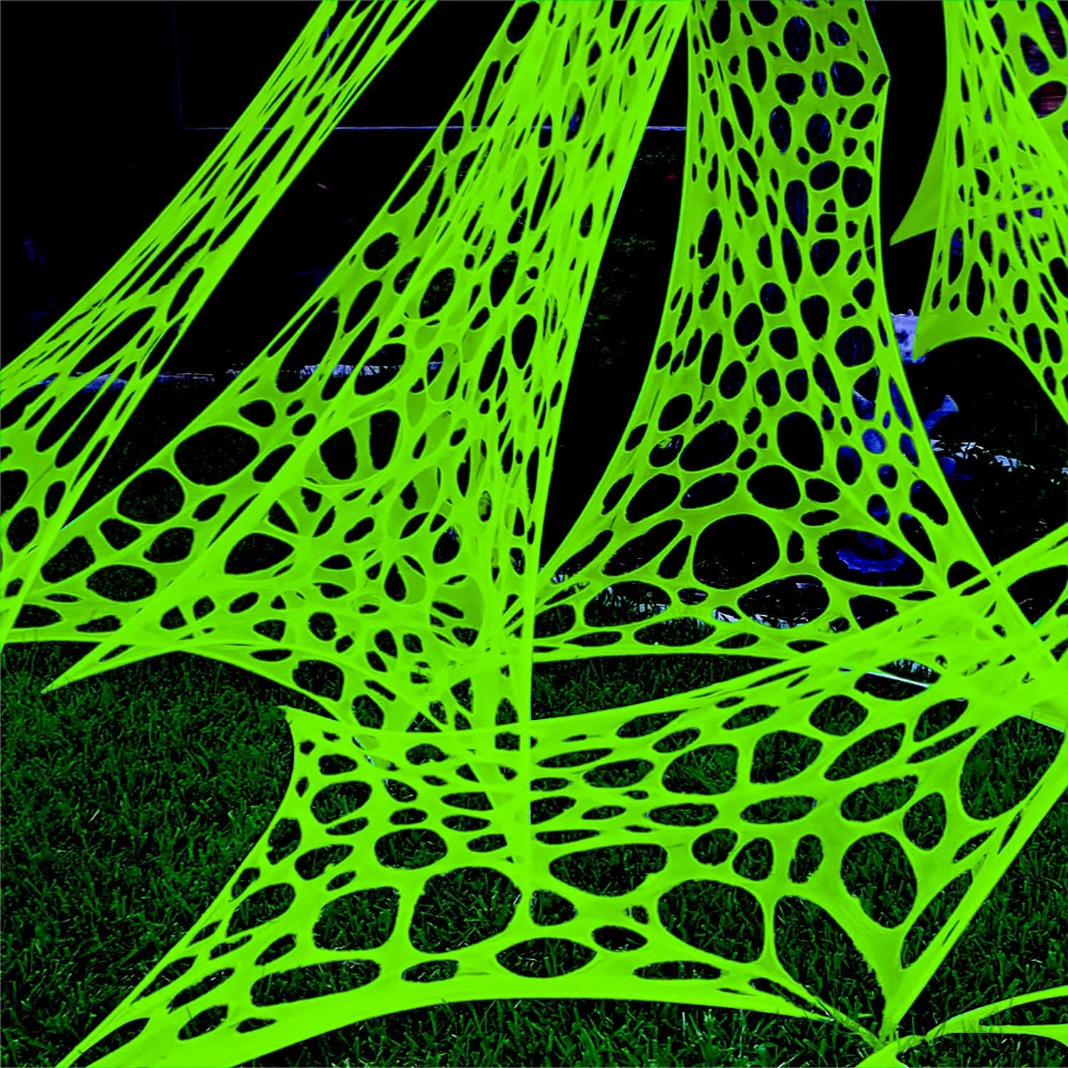Photo 1 of YHFUISK 700 sqft Giant Durable Spider Web for Halloween Decoration Outdoors, Glow in The Dark Stretchy Beef Netting, Green Giant Spider Web Outdoor Decoration (24FT x 4FT)