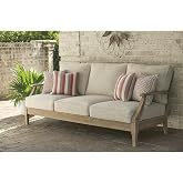 Signature Design by Ashley Clare View 1-Piece Eucalyptus Outdoor Sofa | Weather-shielded 5-step eucalyptus finish, Stain-resistant Nuvella fabric, Deep-seated 3-person frame with 4 accent pillows
