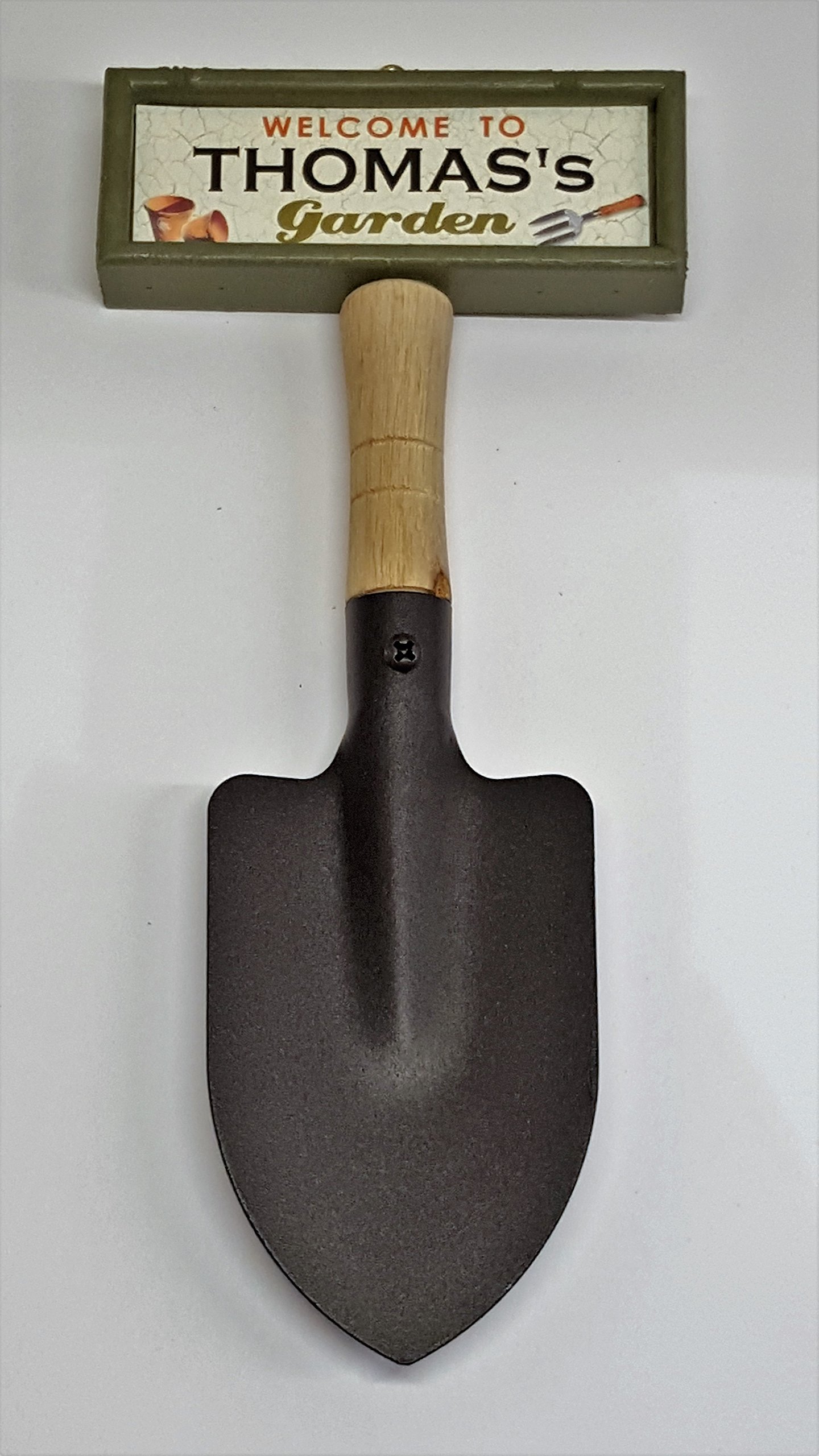 "Welcome to Thomas's garden" hanging shovel sign