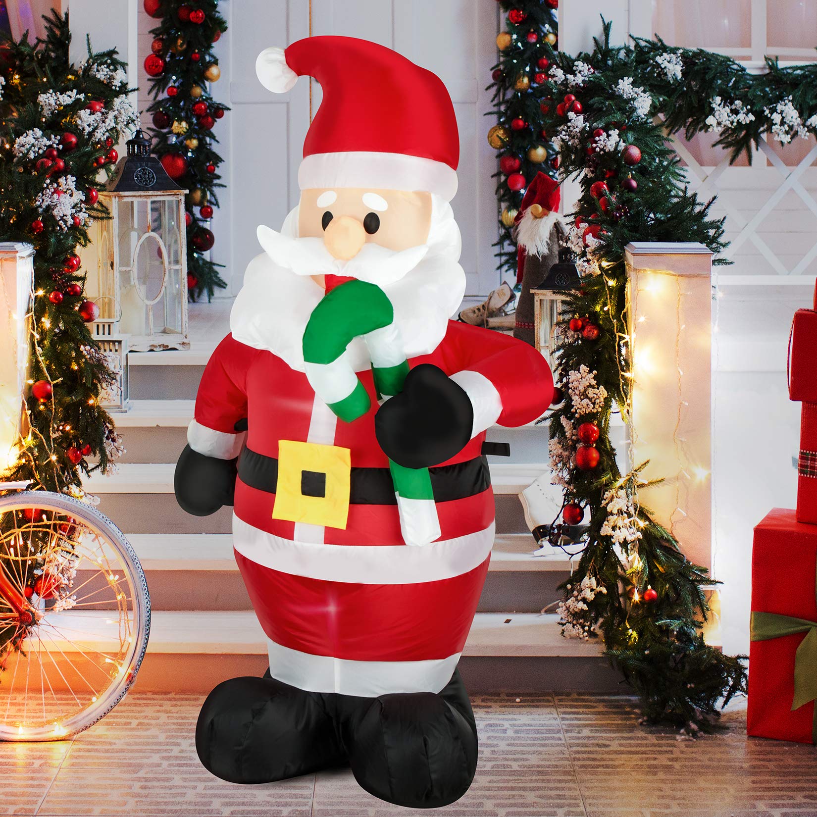 Photo 1 of FARONZE Christmas Inflatable Santa Claus Holds Candy Cane Lighted Indoor & Outdoor Christmas Yard Lawn Blow-Up Decoration with Built-in Fan and Anchor Ropes 4 Feet Tall (Santa Holds Candy Cane)