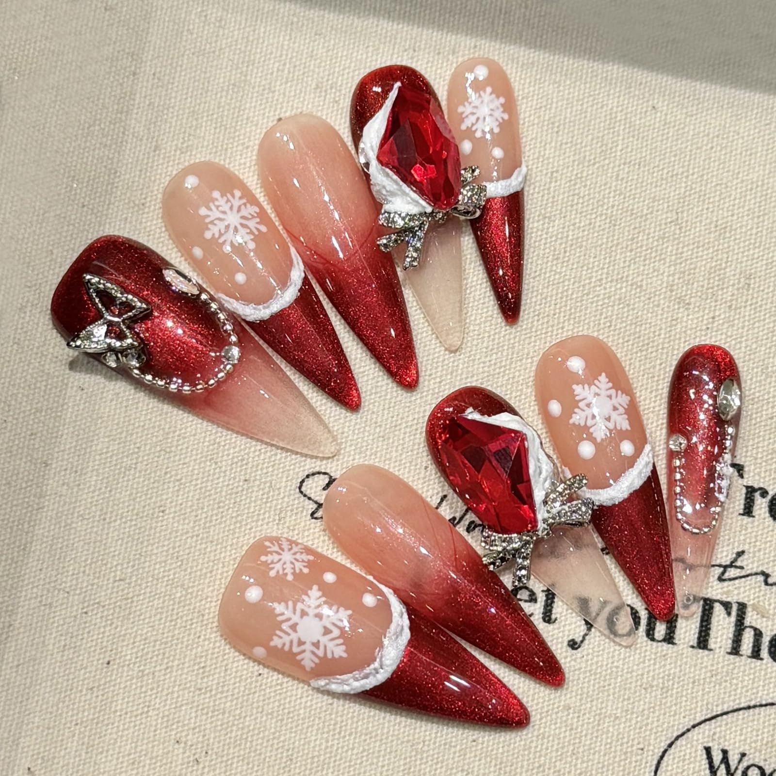Photo 1 of 10Pcs Christmas Handmade Press on Nails Long Stiletto LRKNNO Red French Tip Fake Nails with 3D Bow Rhinestones Designs White Snowflake False Nails Winter Full Cover Stick on Nails for Women Nail Kit