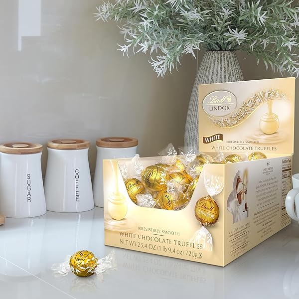 LINDT LINDOR WHITE CHOCOLATE CANDY TRUFFLES, WHITE CHOCOLATE CANDY WITH SMOOTH, MELTING TRUFFLE CENTER, 25.4 OZ., 60 COUNT