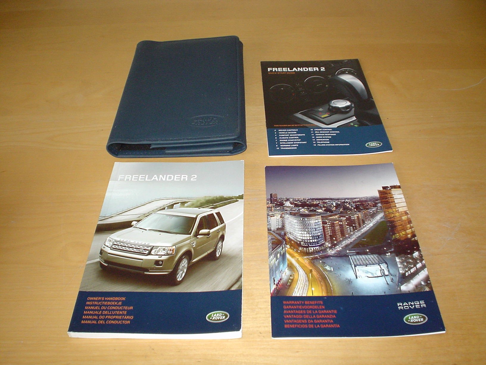 LAND ROVER FREELANDER II 2 OWNERS MANUAL HANDBOOK c/w WALLET (2006 - 2011)  - 3.2L PETROL & 2.2L DIESEL - OWNER'S HAND BOOK MANUAL Paperback – 2011