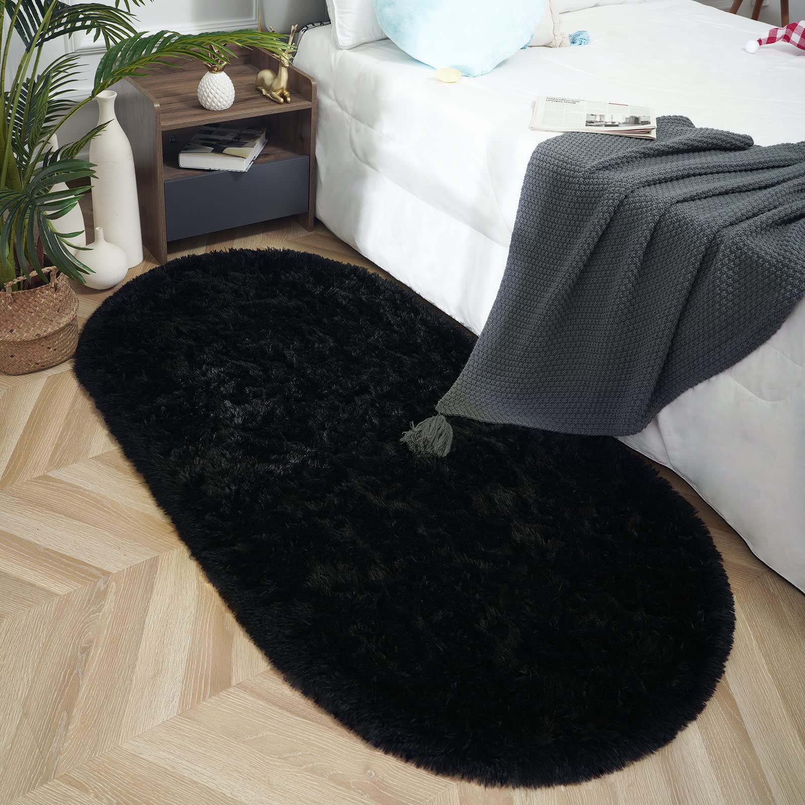 Photo 1 of ISEAU Oval Fluffy Rug Carpets, Modern Plush Shaggy Area Rugs for Kids Bedroom Extra Comfy Cute Nursery Mat Bedside Rug for Boys Girls Room Home Decor Mats, 2.6 x 5.3ft, Black