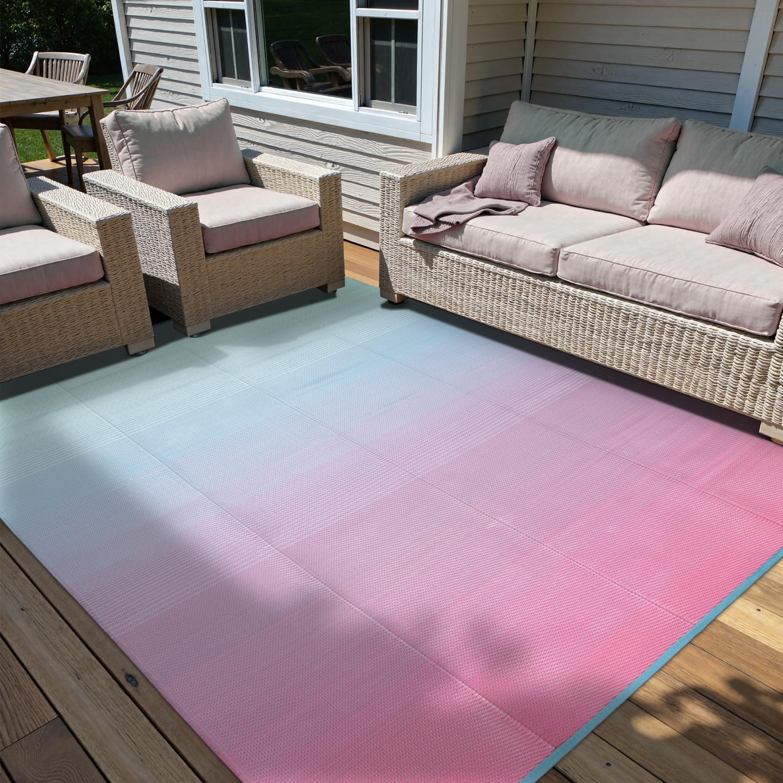 Photo 1 of Anidaroel 6x9 Ombre Outdoor Rug for Patios Clearance, Waterproof Outdoor Plastic Straw Mat, Reversible Outdoor Area Rug for Patio, RV Outdoor Rugs for Camping, Deck, Backyard(Pink& Blue,6'x9')