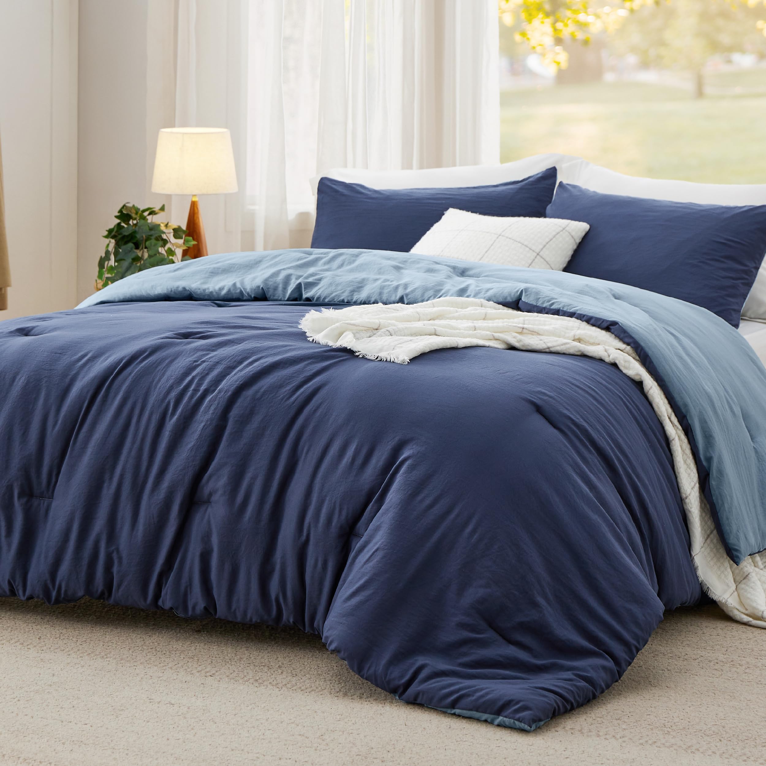 Photo 1 of Bedsure Queen Size Comforter Set, Reversible Navy Soft Prewashed Bedding for All Seasons, 3 Pieces Warm Down Alternative Bed Set, 1 Lightweight Comforter (90"x90") and 2 Pillowcases (20"x26")