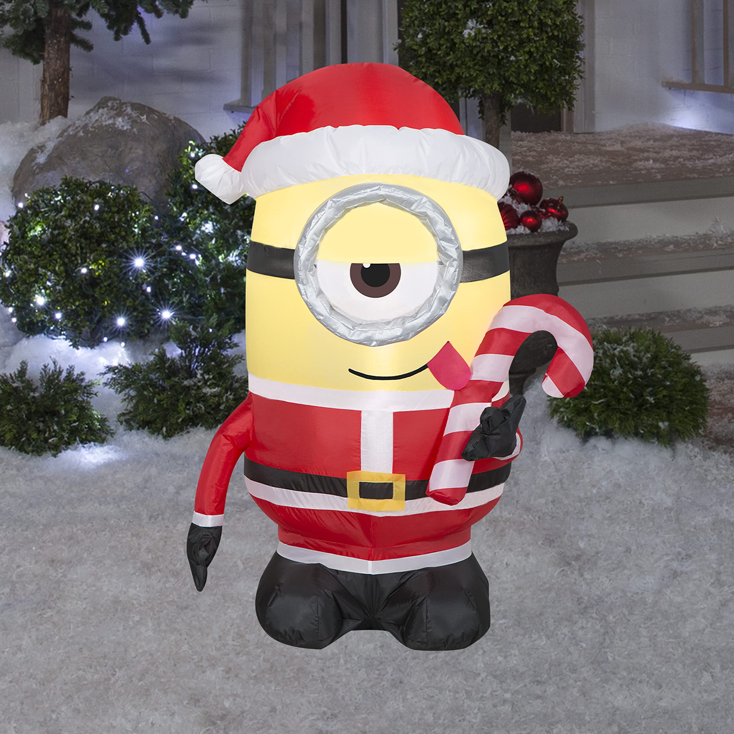 Photo 1 of Gemmy Christmas Airblown Inflatable Inflatable Minion Stuart Licking Candy Cane, 3.5 ft Tall, Yellow