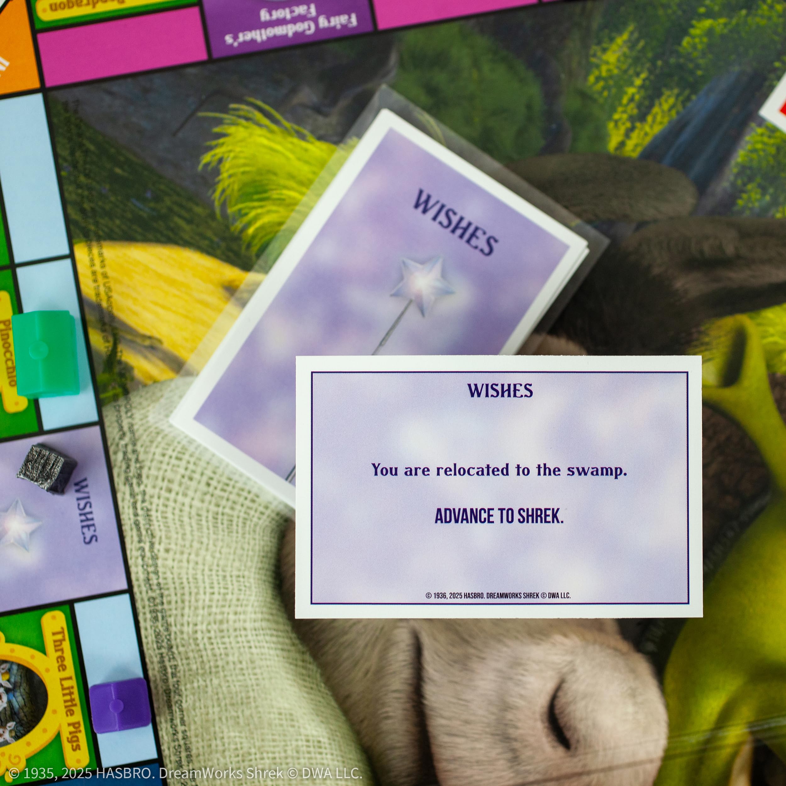 MONOPOLY: Shrek Edition Board Game, Buy, Sell & Trade, Iconic Fairy Tale Characters like Shrek, Donkey, Puss n Boots & More, Classic Family Game for Ages 8+, Officially Licensed DreamWorks Merchandise