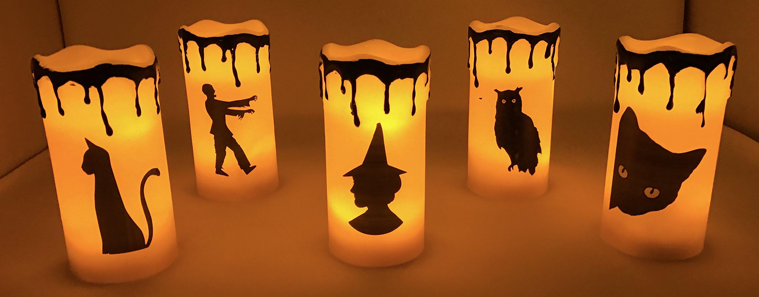 Haunted Halloween LED Lighted Flameless Candle Flicker Wax Candles five (5) 5-3/4" T Candles Set.