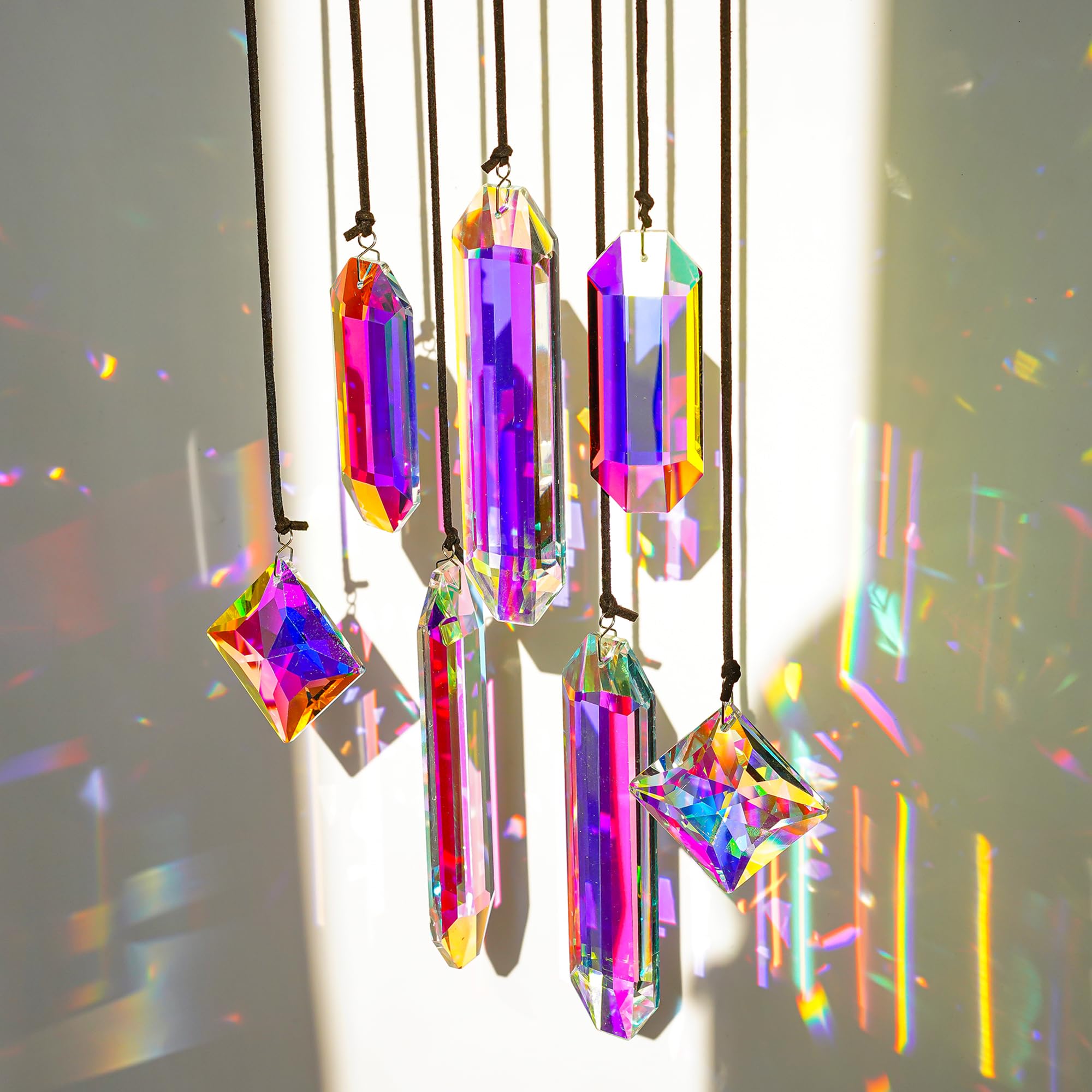 Photo 1 of HDCRYSTALGIFTS Set 7 Crystal Sun Catcher Prisms, AB Colored Suncatcher Crystals Indoor Window Hanging Christmas Ornaments Rainbow Maker Prisms for Home Garden Decor