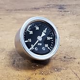 60 psi Oil Pressure Gauge for Motorcycles, 1/8" NPT for Harley, Black Face | 60 psi Oil Pressure Gauge for Motorcycles. 1/8" Male NPT. Shock Proof, Liquid Filled. Stainless Case with Black Gauge Face