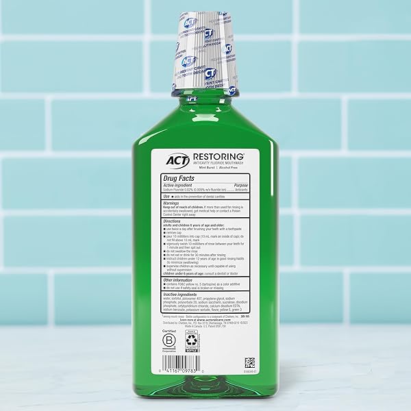 ACT RESTORING ZERO ALCOHOL FLUORIDE MOUTHWASH 33.8 FL. OZ. STRENGTHENS TOOTH ENAMEL, MINT BURST