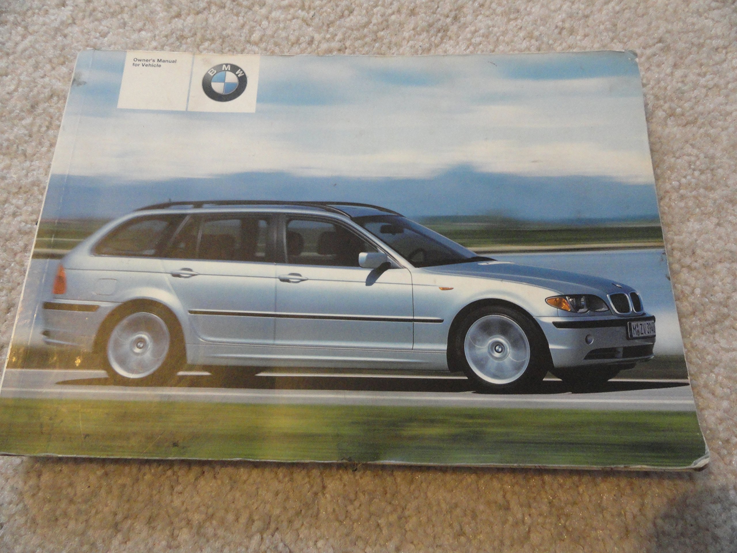 2003 BMW 325i and 325xi Wagon Owners Manual - Good condition with some  stains on some pages Paperback – 2002