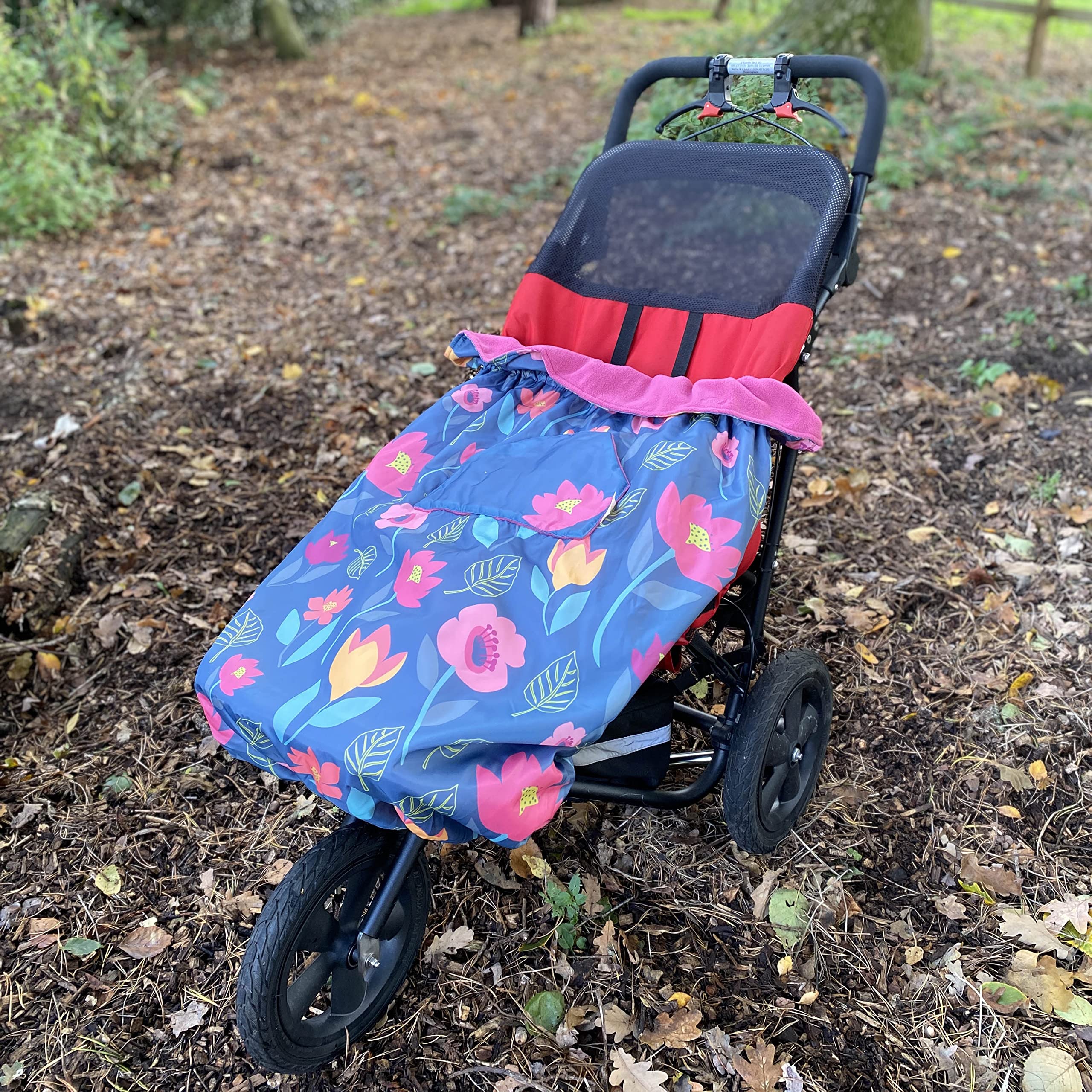 Bundlebean – Children’s Wheelchair Cosy – Fleece‑Backed Waterproof Nylon, Front Hand-Warming Pouch, Adjustable Straps – Universal Fit for Wheelchairs and Special Needs Buggies - Child Size (Floral)