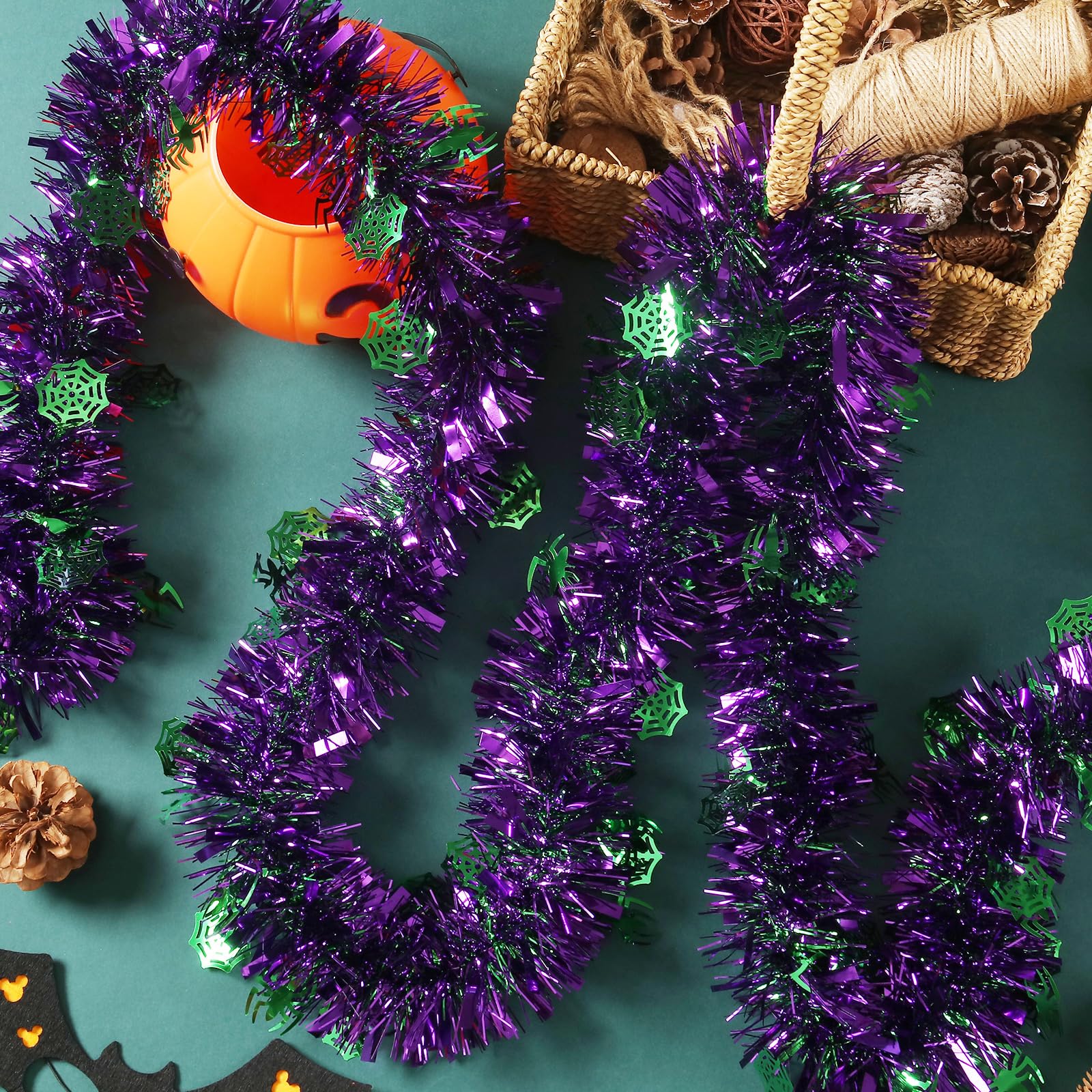 Photo 1 of 100 Feet Halloween Tinsel Garland Purple Green Spider Web Holiday Metallic Tinsel Twist Hanging Decorations for Birthday Halloween Party Supplies Indoor Outdoor Decoration (Spider)