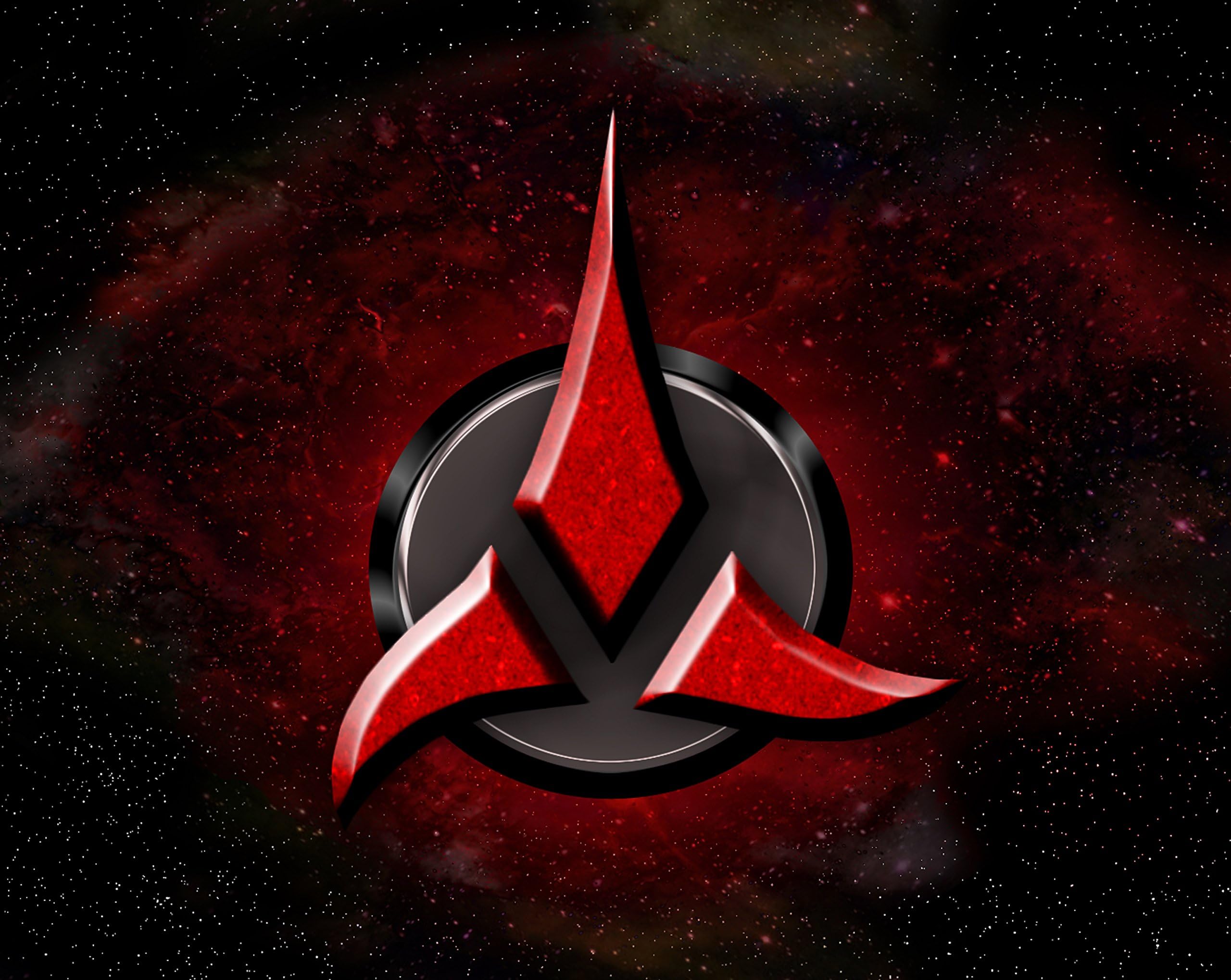 MOUSE MAT featuring a version of the Klingon insignia from the Star Trek universe.