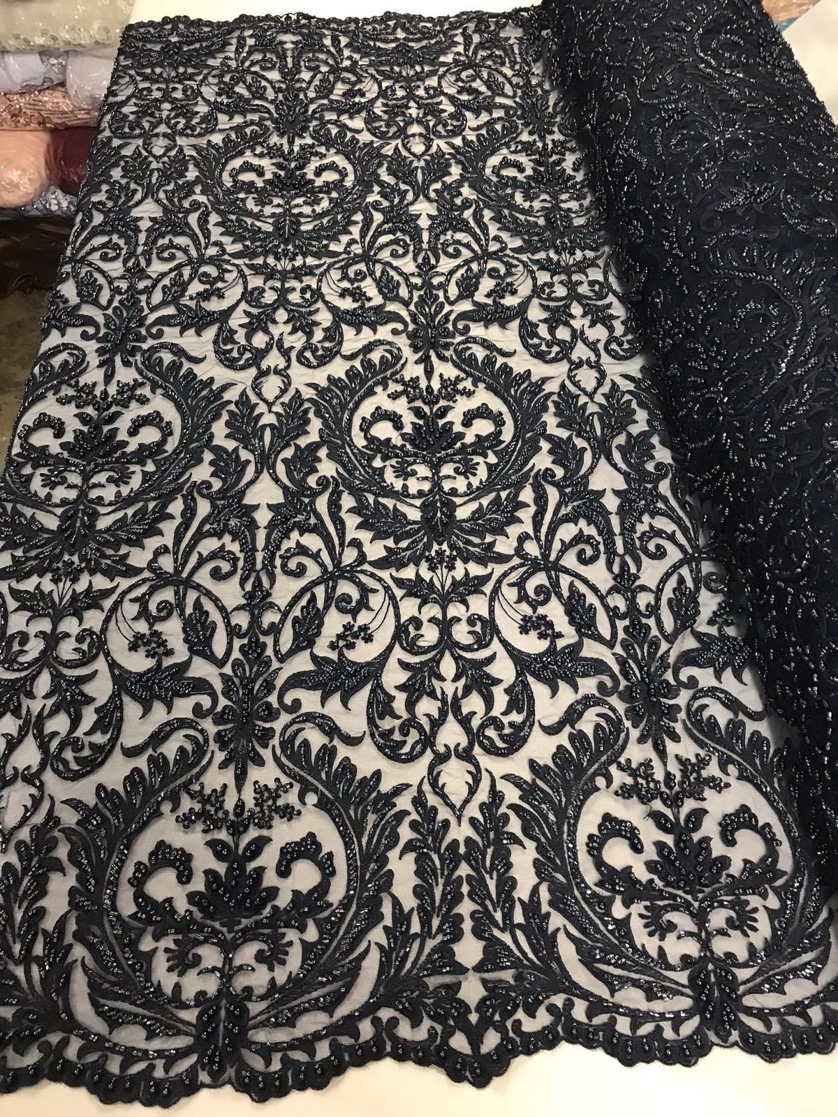 NAVY BLUE PRINCESS DESIGN EMBROIDERY WITH HEAVY BEADS ON A MESH-SOLD BY YARD.
