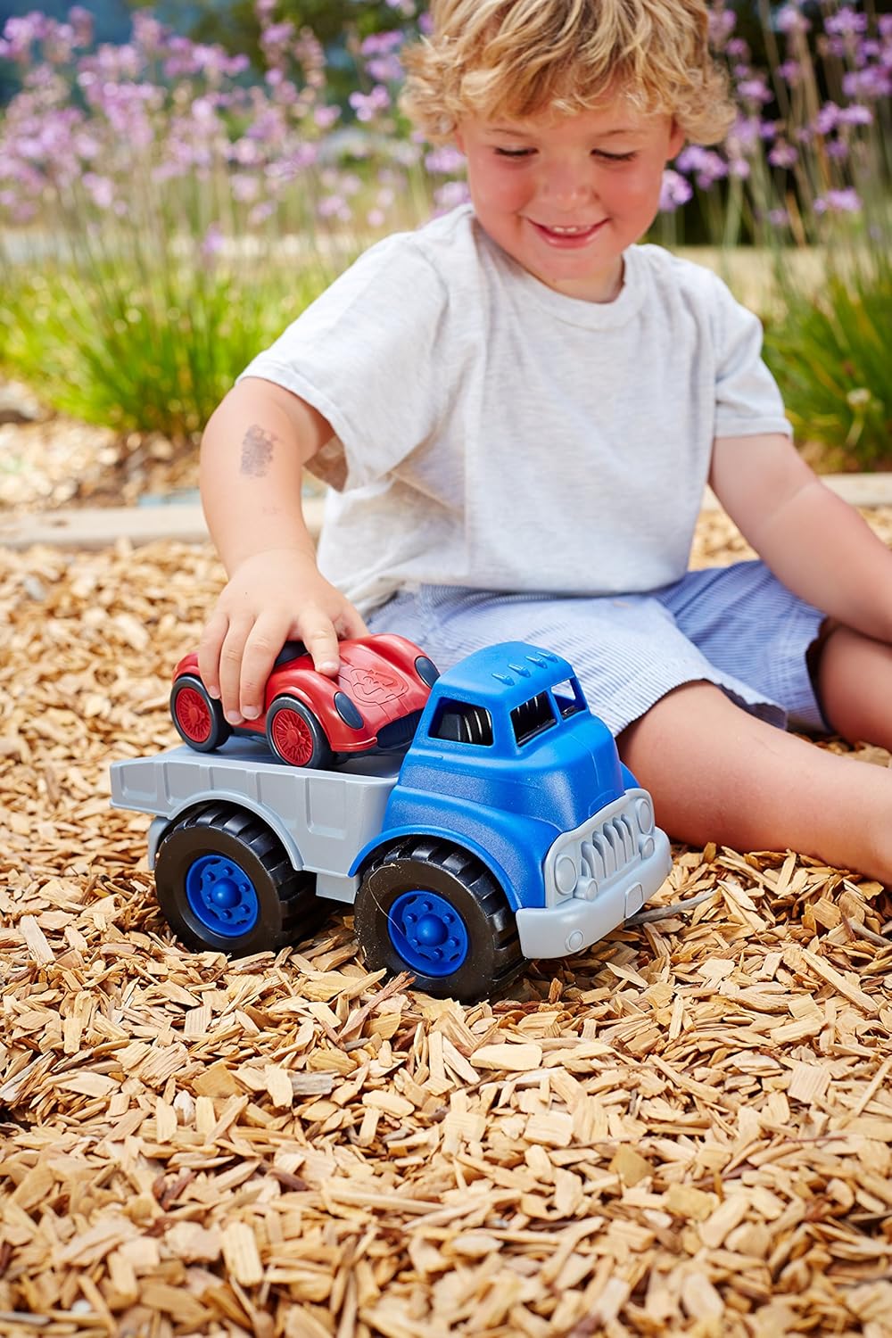 green toys flatbed truck and race car