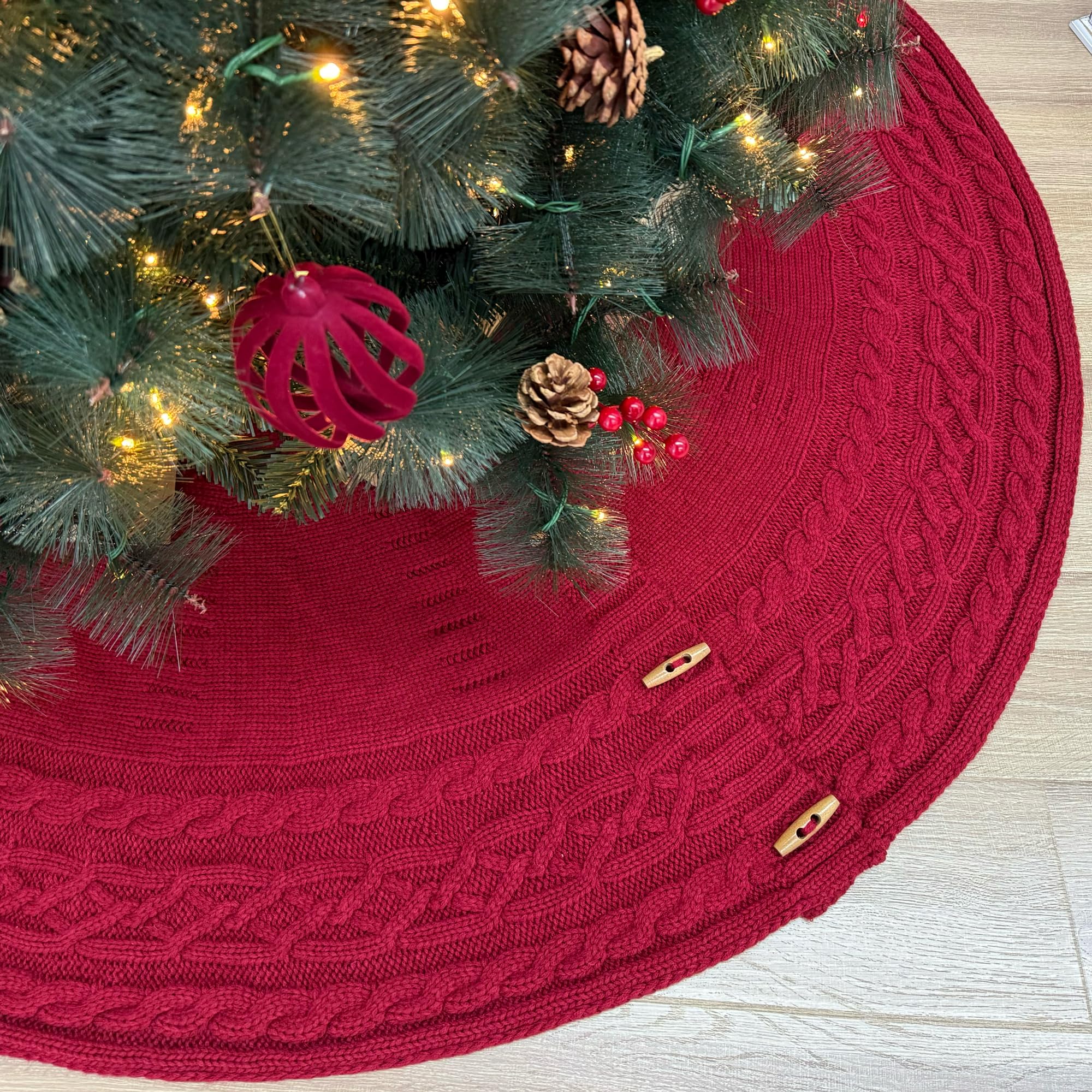 Photo 1 of Starry Dynamo 60-Inch Cable Sweater Knit Christmas Tree Skirt with Wooden Toggles, Burgundy