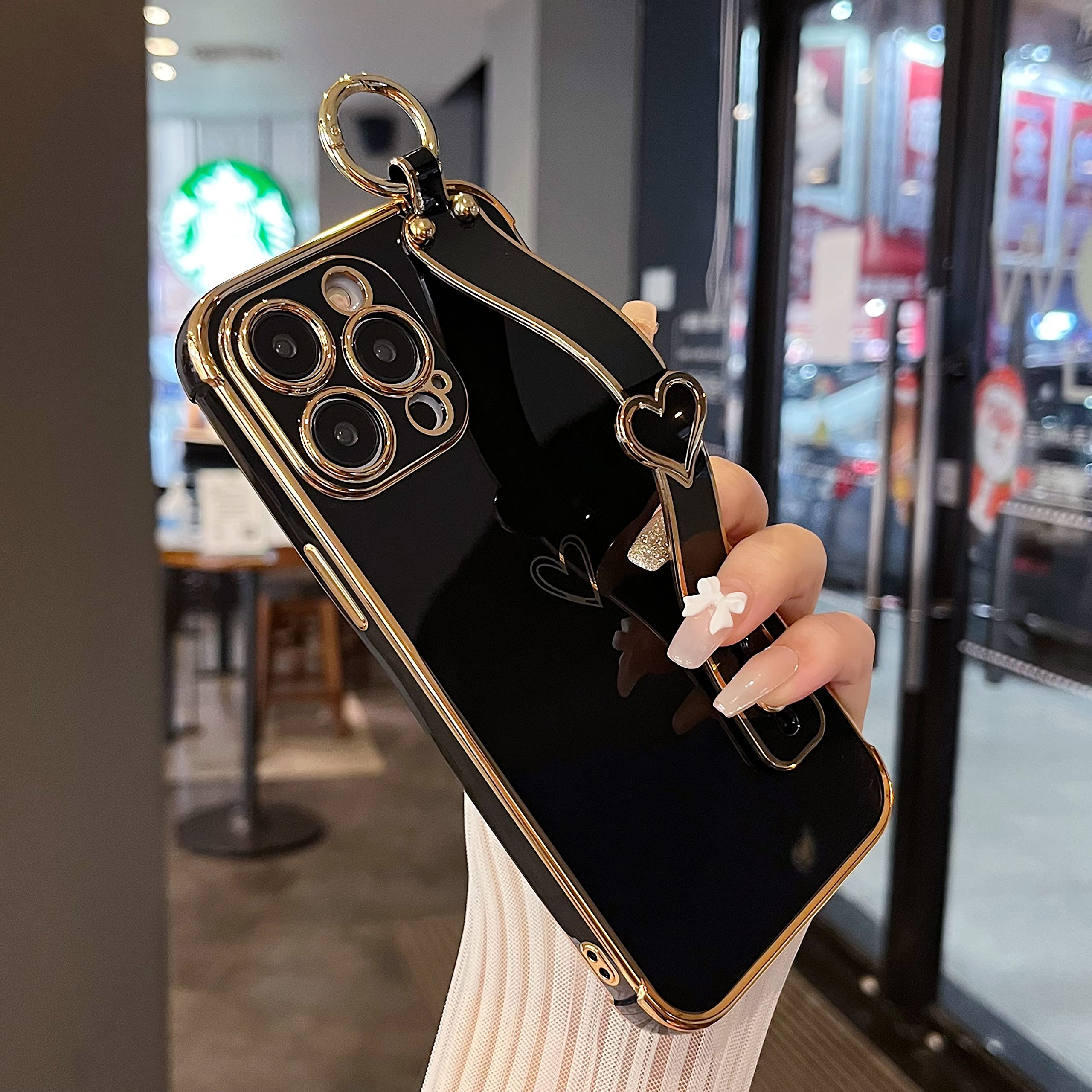 ZTOFERA Compatible with iPhone 14 Pro Max Case with Wrist Strap, Flexible Silicone Protective Phone Case with Cute Heart Pattern Hand Strap Stand Finger Holder Gold Trim Shockproof Bumper Cover, Black