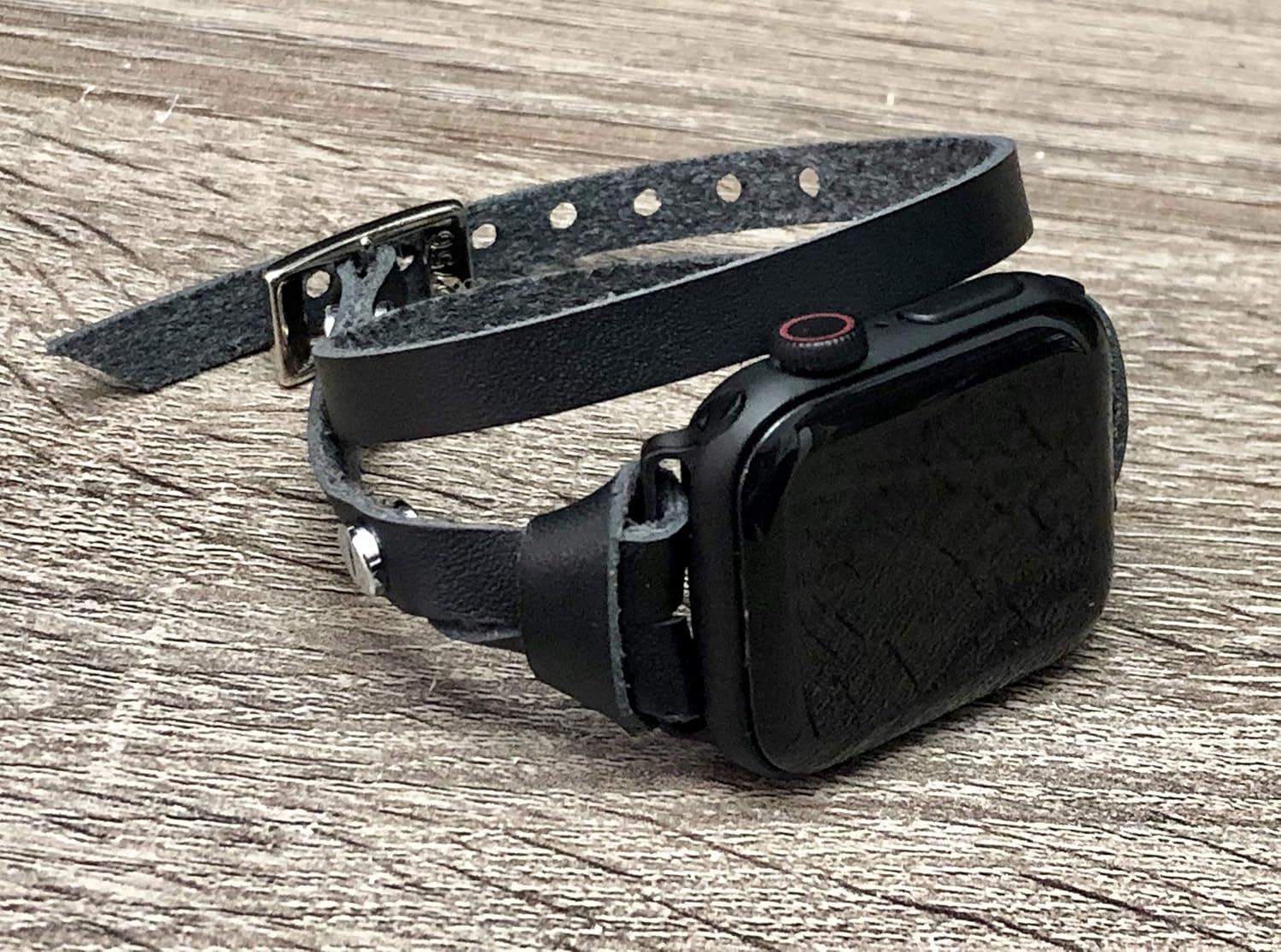 space gray apple watch with leather band