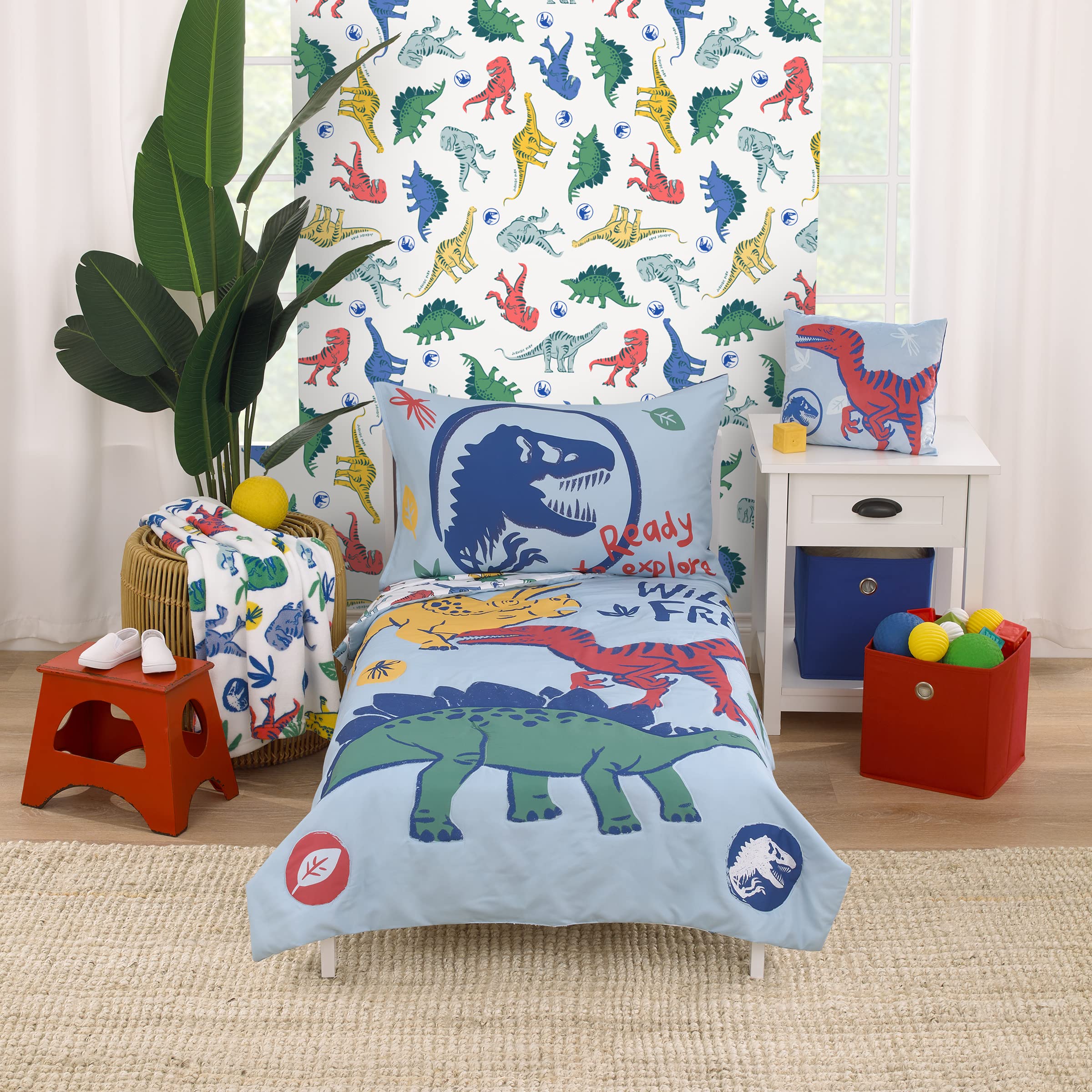 Photo 1 of NoJo Universal Jurassic World Wild and Free Blue, Green, and Yellow Dinosaur 4 Piece Toddler Bed Set - Comforter, Fitted Bottom Sheet, Flat Top Sheet, Reversible Pillowcase