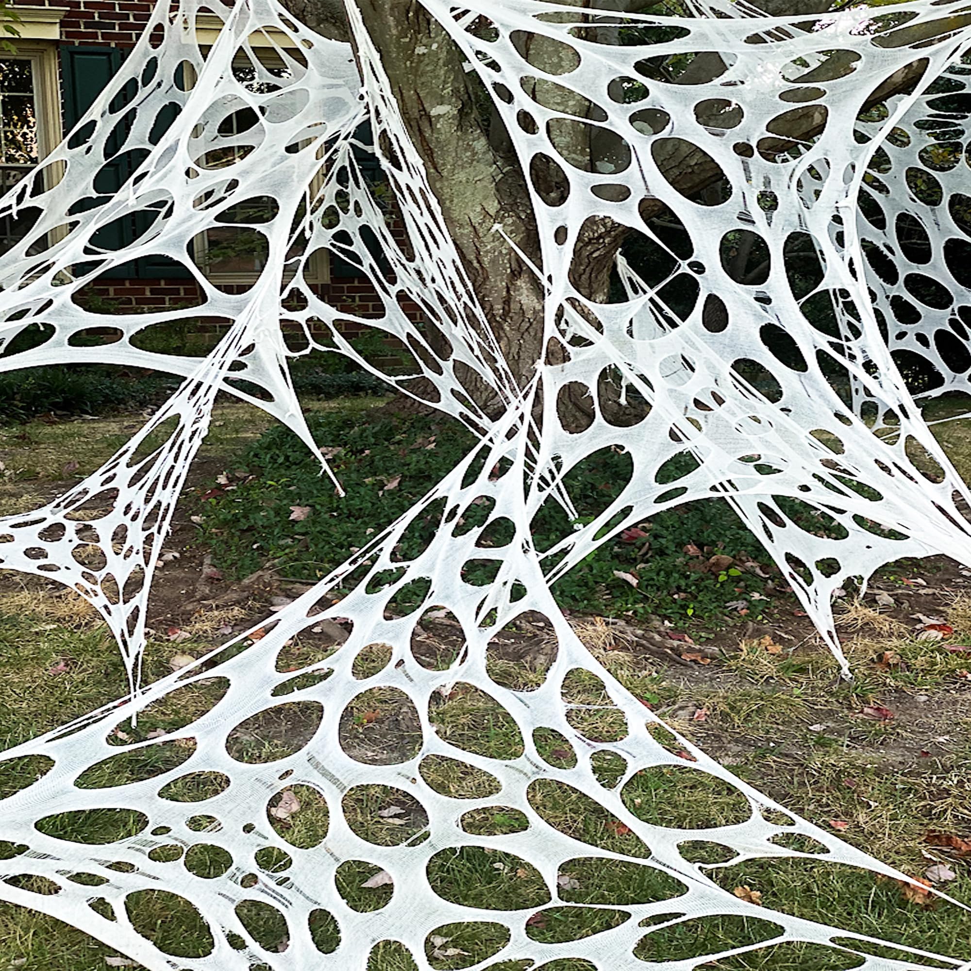 Photo 1 of Halloween Decorations Outdoor Spider Web 26.9X12.46ft: Cut Your Own Giant Stretchy Beef Netting Spiders Webbing Gauze Cobweb Haunted House Decor